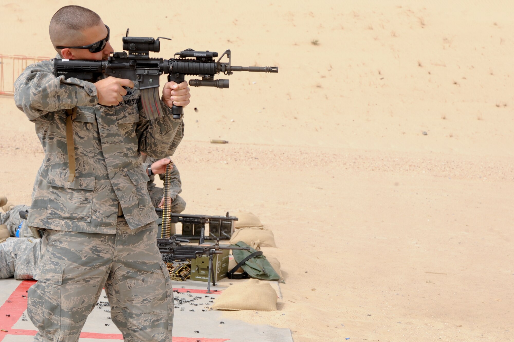 SOUTHWEST ASIA -- Tech. Sgt. Timothy Sands, 332nd Air Expeditionary Wing flight safety NCO in charge, fires the M4 assault rifle during a weapons familiarization and refresher course at an undisclosed location in Southwest Asia, March 23, 2012. Wing Staff Agency members received weapons familiarization training on multiple weapons that the 332nd Expeditionary Security Forces Squadron uses on a daily basis. Sands is deployed from Kirkland Air Force Base, N.M. and is a native of Albuquerque, N.M. (U.S. Air Force photo by Staff Sgt. Joshua J. Garcia)
