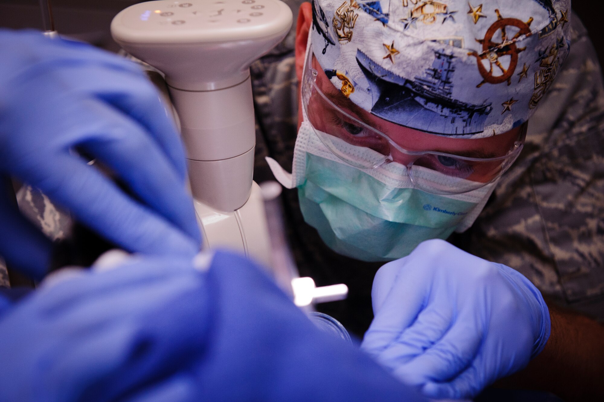 SOUTHWEST ASIA – U.S. Air Force Senior Airman Jason Eckenrode, 379th Expeditionary Medical Group dental technician, cleans Roy’s teeth here March 15, 2012. (U.S. Air Force photo/Staff Sgt. Nathanael Callon)