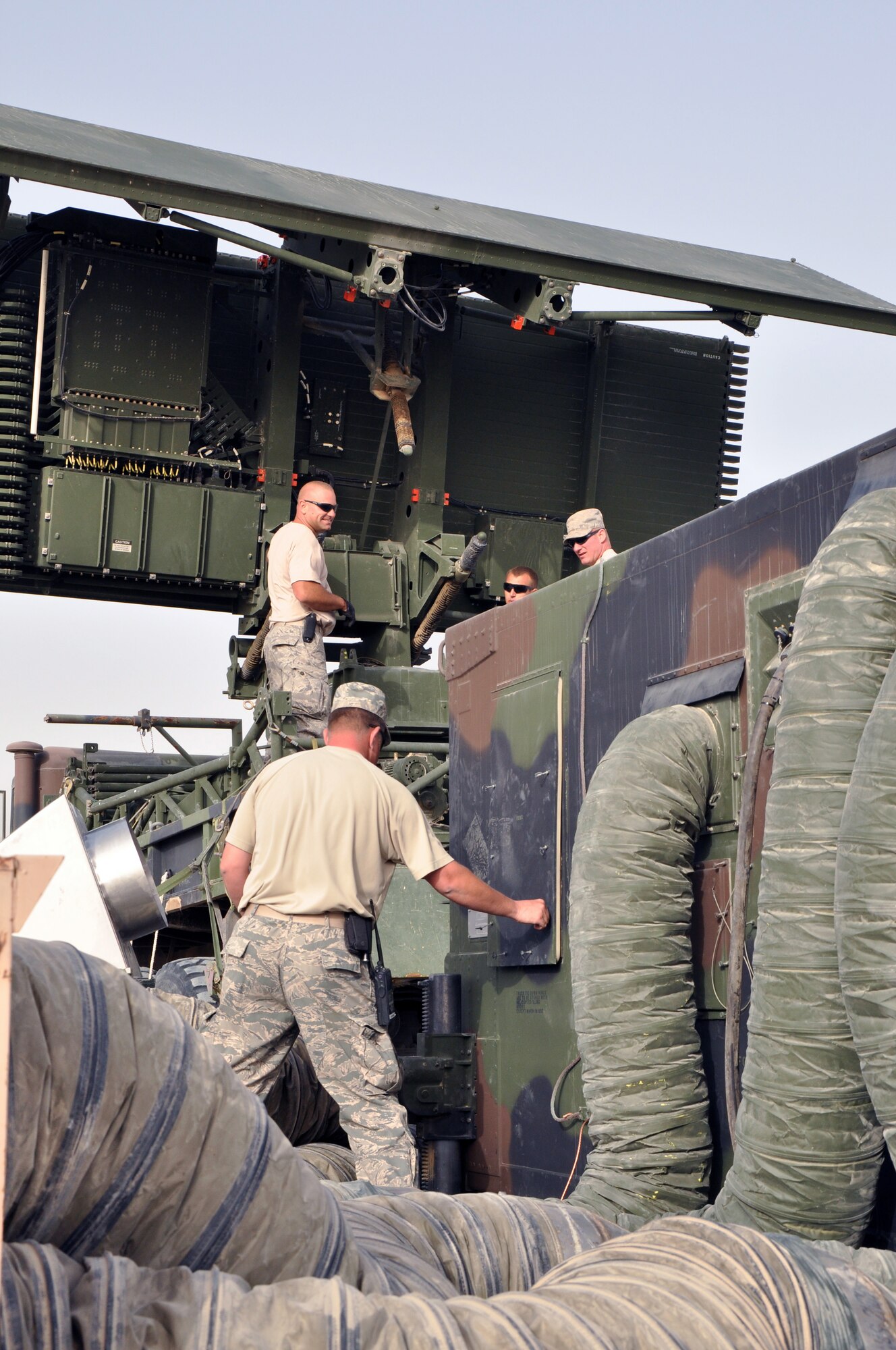 SOUTHWEST ASIA  - Members of the 727th Expeditionary Air Control Squadron set up their newest radar at the 380th Air Expeditionary Wing March 18, 2012. The TPS-75 radar will help them monitor aerial activity in support of the defense of the Arabian Gulf. (U.S. Air Force photo/1st Lt. Victoria Porto)