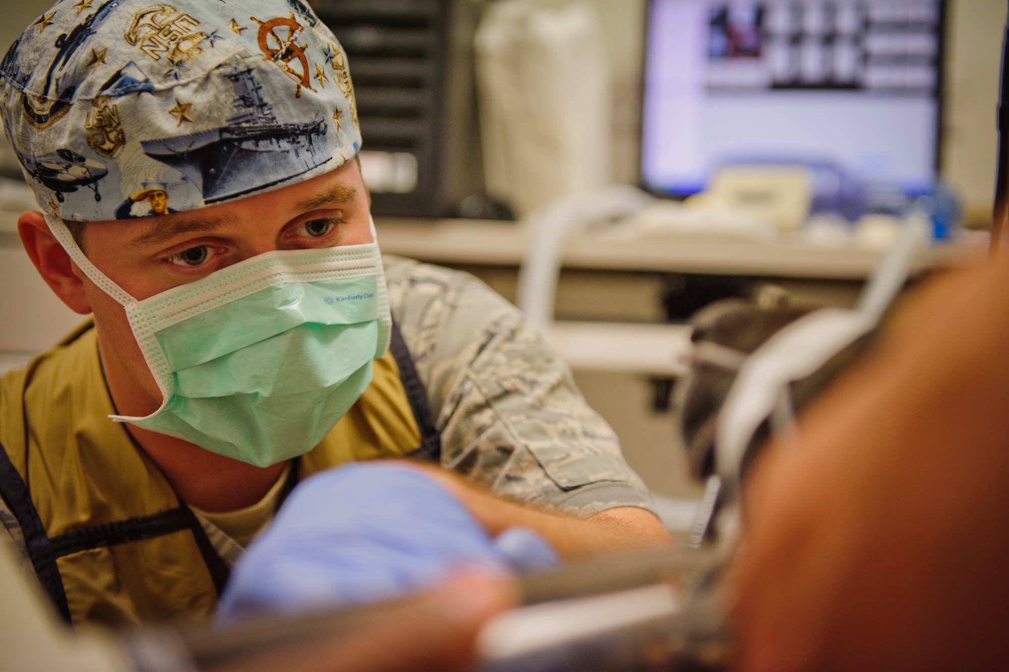 SOUTHWEST ASIA – U.S. Air Force Senior Airman Jason Eckenrode, 379th Expeditionary Medical Group dental technician, looks back at the computer to see if the x-rays came out correctly here March 15, 2012. (U.S. Air Force photo/Staff Sgt. Nathanael Callon)