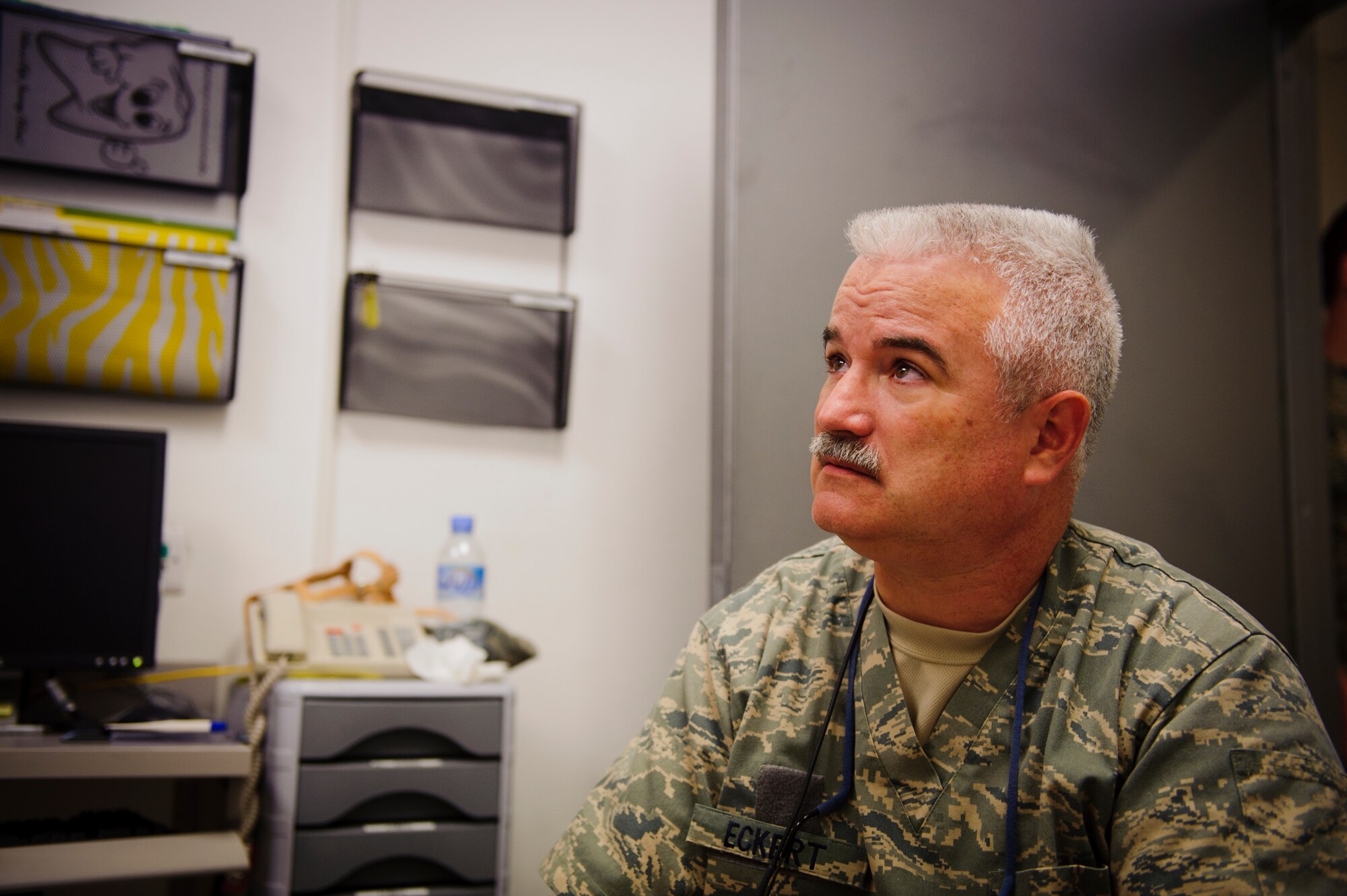 SOUTHWEST ASIA – U.S. Air Force Lt. Col. Richard Eckert, 379th Expeditionary Medical Group dentist, speaks with U.S. Army 1st Lt. Maria Harris, 422nd Medical Detachment Veterinary Services veterinarian, before taking x-rays of Roy’s teeth here March 15, 2012. (U.S. Air Force photo/Staff Sgt. Nathanael Callon)