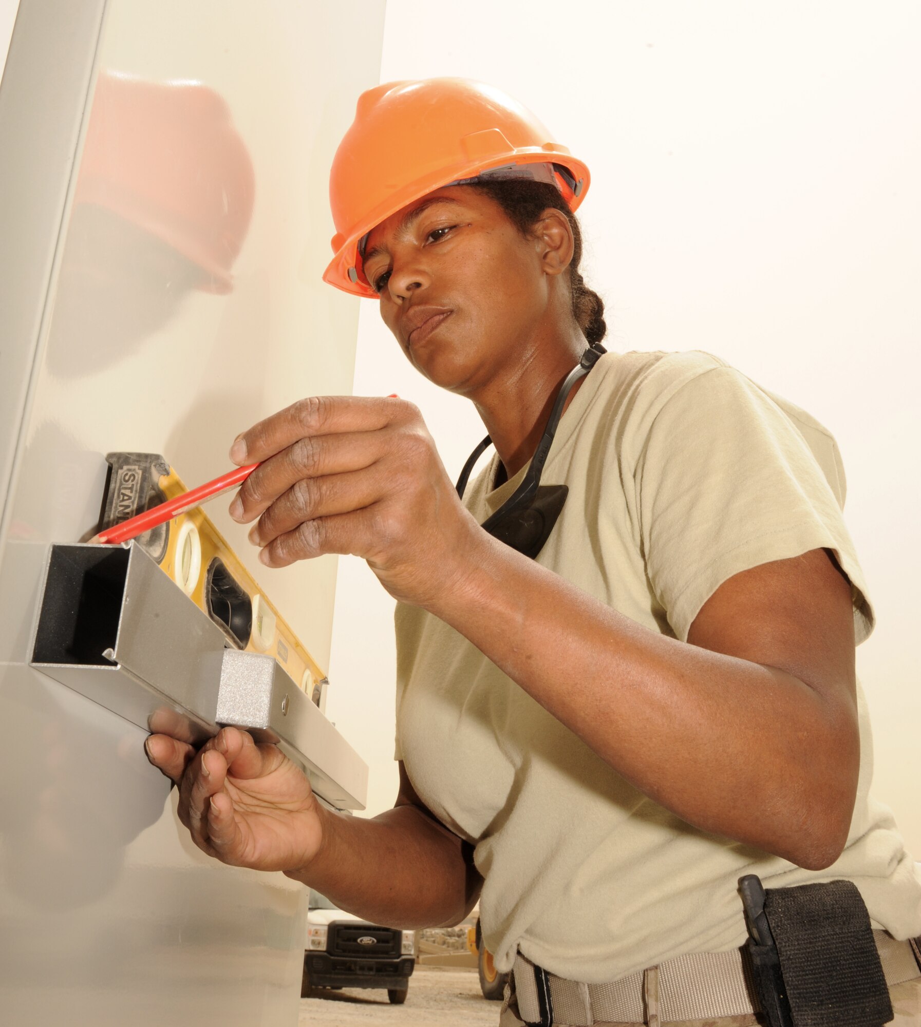 SOUTHWEST ASIA - Tech. Sgt. Donna Southwood-Smith marks the location to place a handle on a door March 22, 2012. Roughly 30 Rapid Engineer
Deployable Heavy Operations Repair Squadron Engineers are deployed to assist the 380th Air Expeditionary Wing as the base mission evolves to an enduring operation. RED HORSE units can go anywhere in the world and build whatever's needed there, all while being as self-sufficient as possible.
Southwood-Smith is deployed from Seymour Johnson Air Force Base, N.C. (U.S. Air Force photo/Tech. Sgt. Arian Nead)
