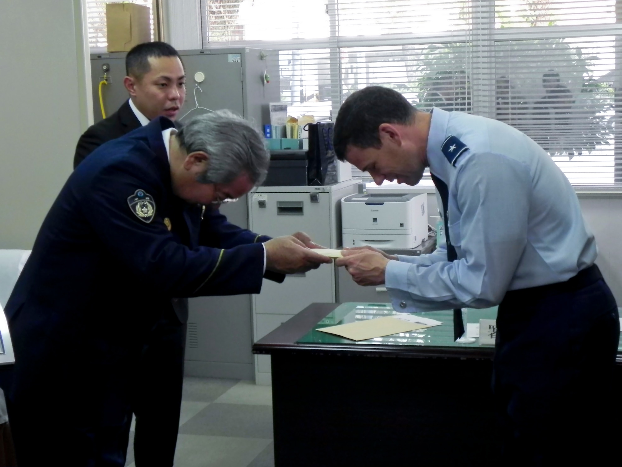 Brig Gen Matt Molloy, 18th Wing commander, presents a certificate of appreciation and a wing coin to Kiyomasa Yasumura, Chief of the Okinawa Police Station during a visit to the station on March 21. The certificate read, “In appreciation for your outstanding service and cooperation in law enforcement and force protection matters important to Kadena Air Force Base and the lovely people of Okinawa. Your efforts ensured the safety and security of our communities, bringing great honor to the Japanese Police.”
(U.S. Air Force photo by Maj. Christopher Anderson/Released)