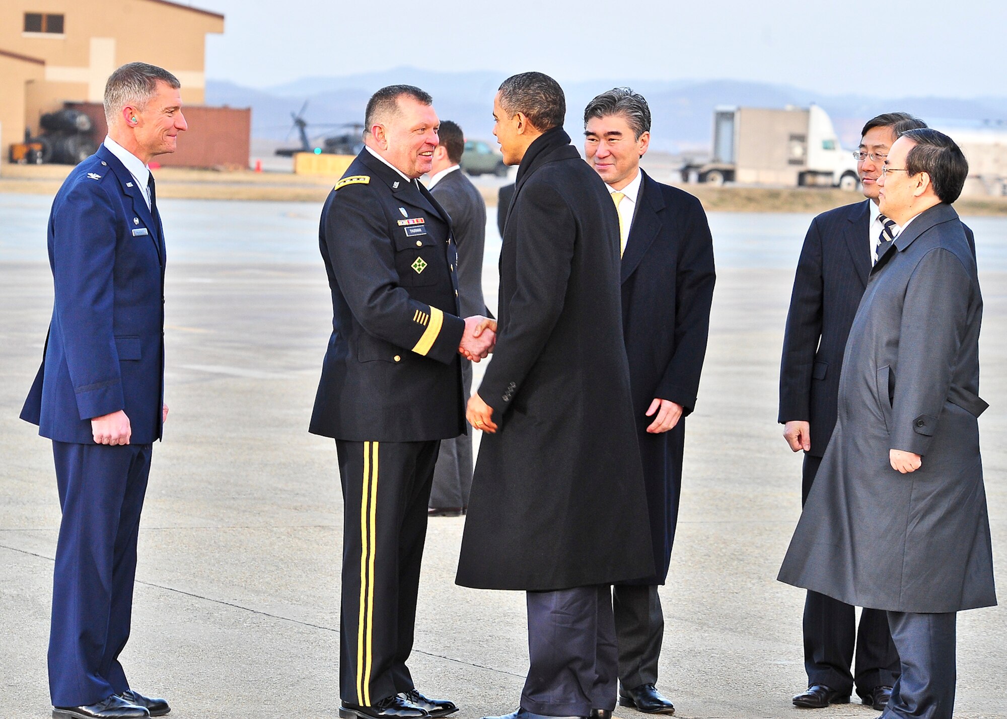 (Left) Gen. James Thurman, United States Forces Korea commander, greets President Barack Obama, March 25, 2012, on the Osan Air Base flightline. The president flew into the base on Air Force One March 25, 2012, on his way to the Nuclear Security Summit in Seoul.  (U.S. Air Force Photo by/ Senior Airman Adam Grant)