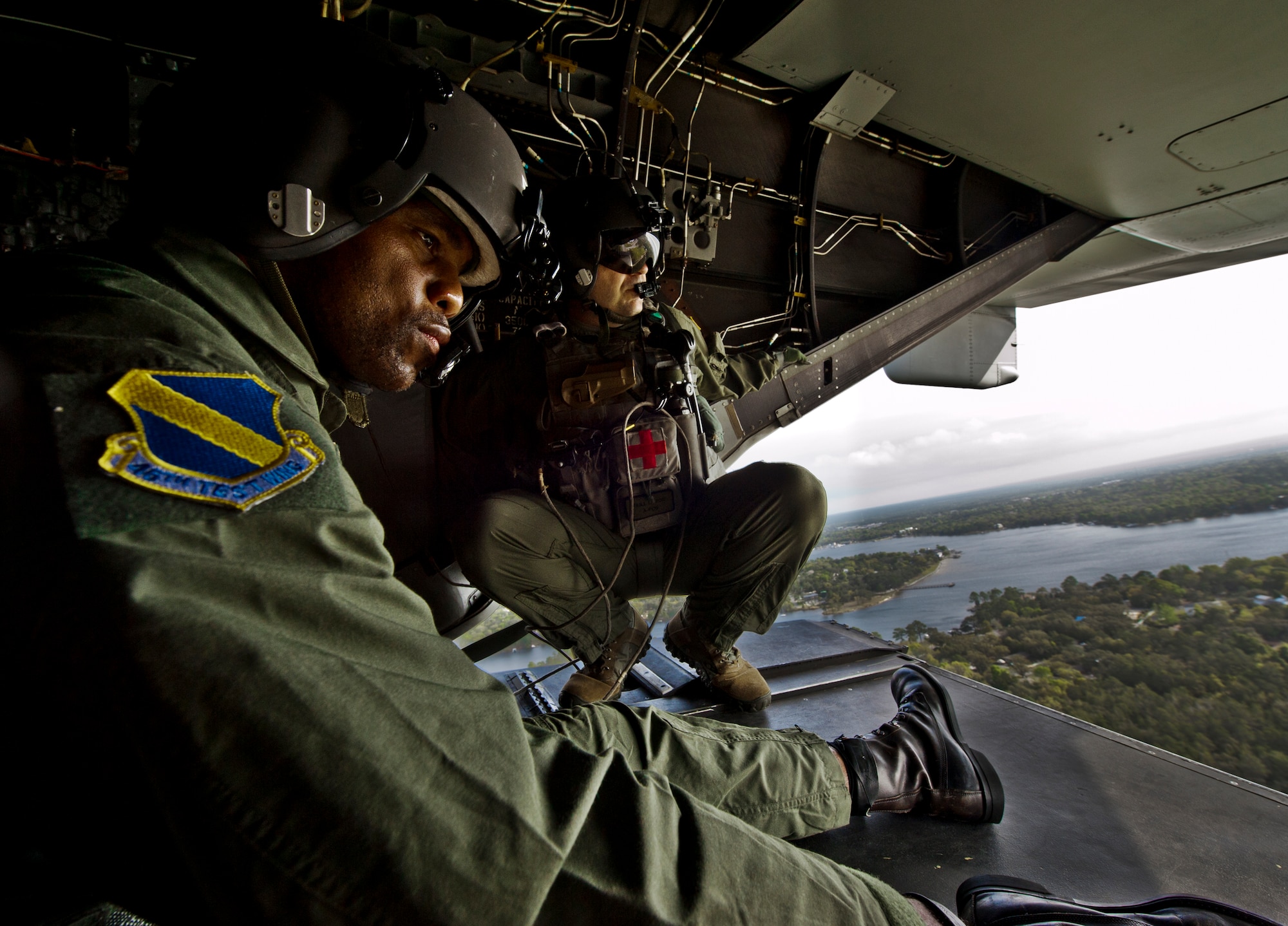 Herschel Walker checks out the view from the back of a CV-22 Osprey with Master Sgt. Joseph Levine, a flight engineer the 413th Flight Test Squadron, March 22.  Walker visited the base to speak about resiliency and the importance of asking for help. He spoke twice to large crowds of Team Eglin members about his life, career and the emotional and mental struggles he encountered throughout.  As well as flying, he also visited the explosive ordnance disposal flight and performed some physical training with Eglin Airmen.  (U.S. Air Force photo/Samuel King Jr.)