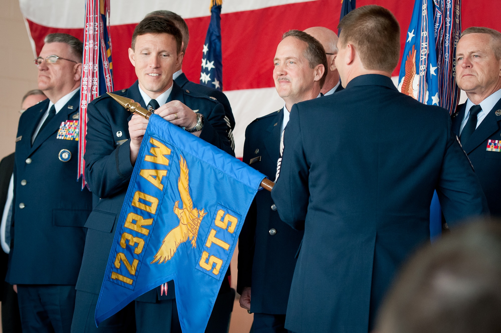 Lt. Col. Jeff Wilkinson, commander of the 123rd Special Tactics Squadron, pins a streamer on squadron's flag during an awards ceremony held March 18, 2012, at the Kentucky Air National Guard Base in Louisville, Ky. The streamer represents an Air Force Meritorious Unit Award, which the squadron won for exceptional performance as part of the 720th Special Tactics Group from October 2009 to September 2011. (U.S. Air Force photo by Senior Airman Maxwell Rechel)