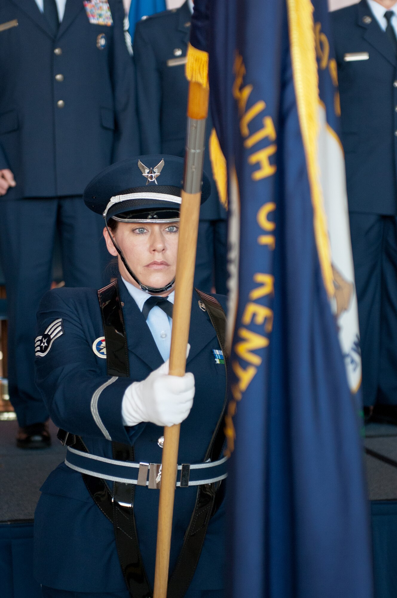 Staff Sgt. Windy Wagner of the 123rd Airlift Wing Honor Guard displays the flag of the Commonwealth of Kentucky during a presentation of the colors conducted March 18, 2012, at the Kentucky Air National Guard Base in Louisville, Ky. The presentation preceded an awards ceremony in which a top White House official, Richard Reed, honored three local units for outstanding service. Reed is special assistant to President Barack Obama for national security affairs. (U.S. Air Force photo by Tech. Sgt. Dennis Flora)