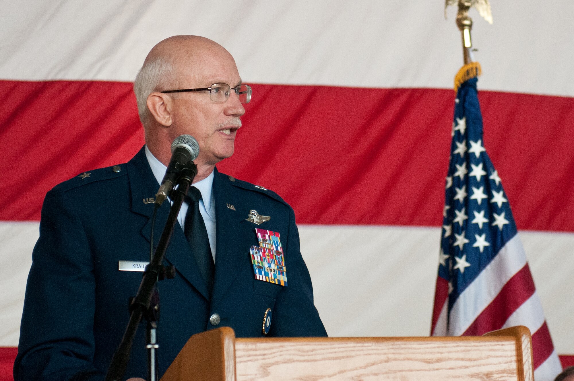 Brig. Gen. Mark Kraus, the Kentucky National Guard's assistant adjutant general for Air, speaks to more than 1,000 Air Guardsmen who gathered in Fuel Cell Hangar at the Kentucky Air National Guard Base in Louisville, Ky., March 18, 2012, for an awards ceremony recognizing the achievements of three local units. Headquarters, Kentucky Air National Guard, accepted its 9th Air Force Organizational Excellence Award. (U.S. Air Force photo by Tech. Sgt. Dennis Flora)