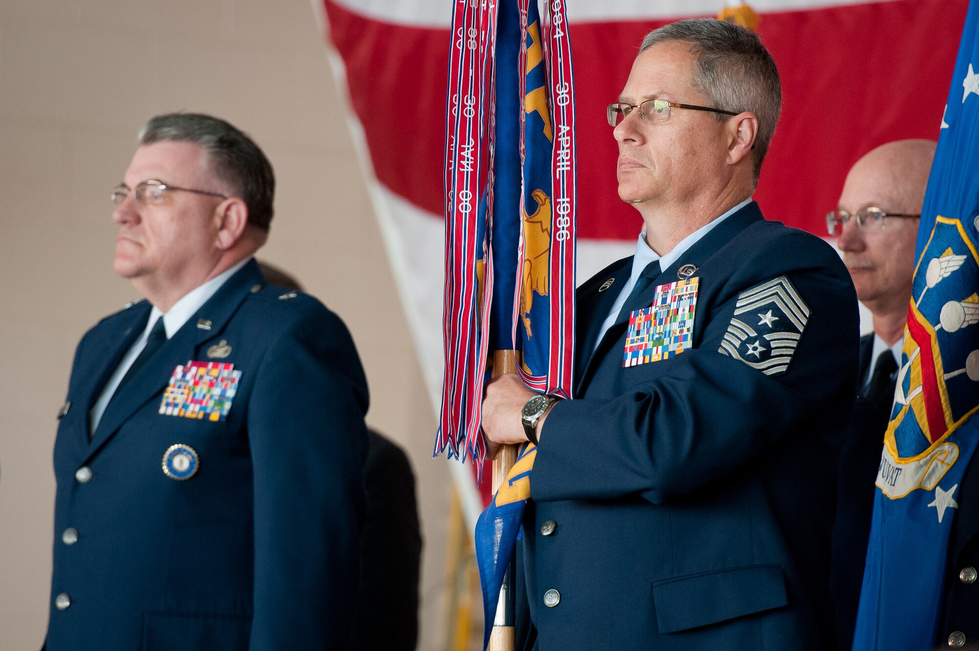 Kentucky Air National Guard State Command Chief Master Sgt. James Smith holds the guidon for State Headquarters during an awards ceremony held at the Kentucky Air National Guard Base in Louisville, Ky., on Mar. 18, 2012. The ceremony recognized three local units for outstanding performance. (U.S. Air Force photo by Senior Airman Maxwell Rechel)