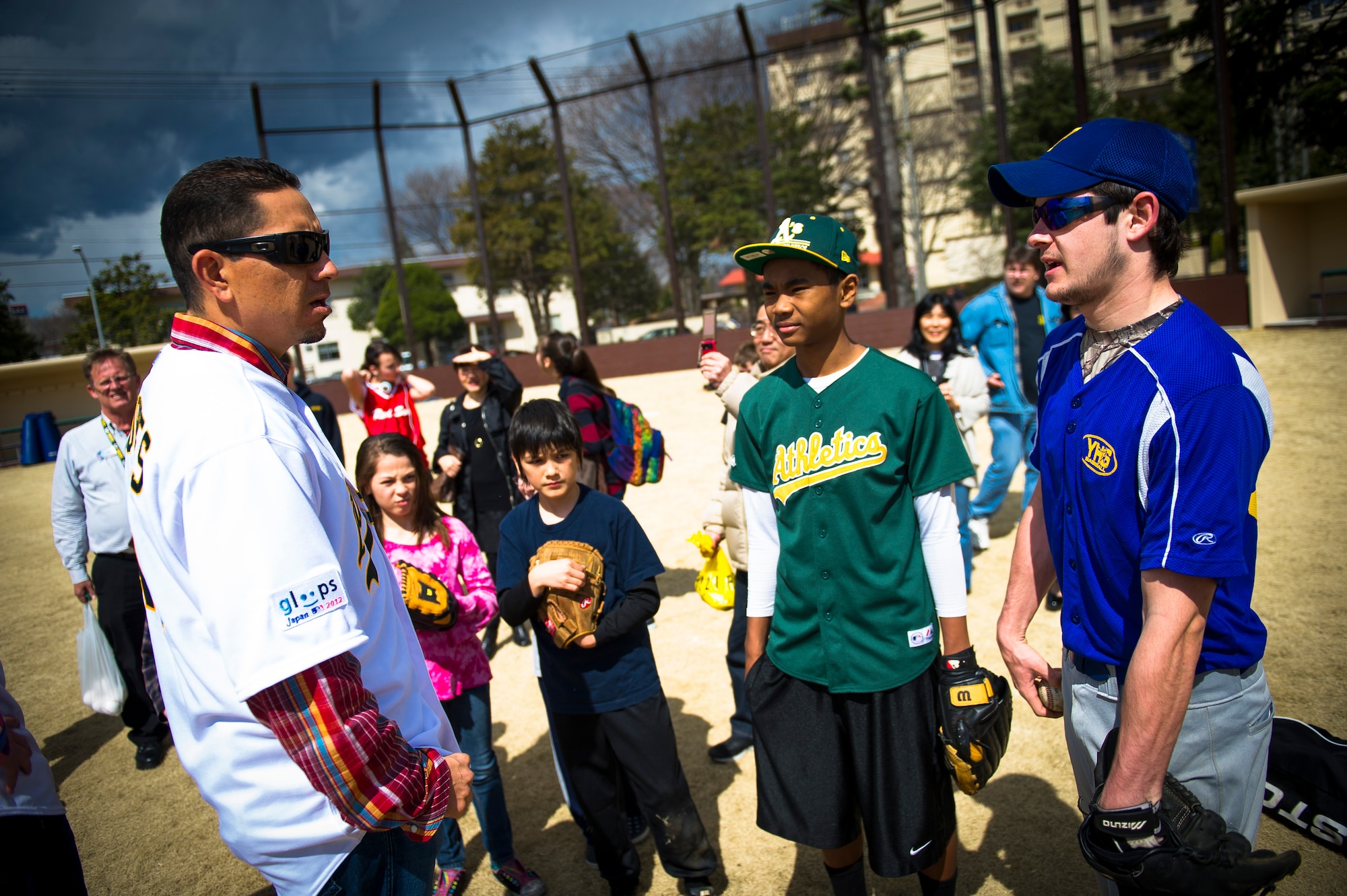 YOKOTA AIR BASE, Japan -- Brian Fuentes, Oakland Athletics starting pitcher, talks with kids here at Yokota Air Base, Japan, March 25, 2012. Brian Fuentes discussed pitching mechanics and even allowed the children to pitch to him. (U.S. Air Force photo/Staff Sgt. Chad C. Strohmeyer)
