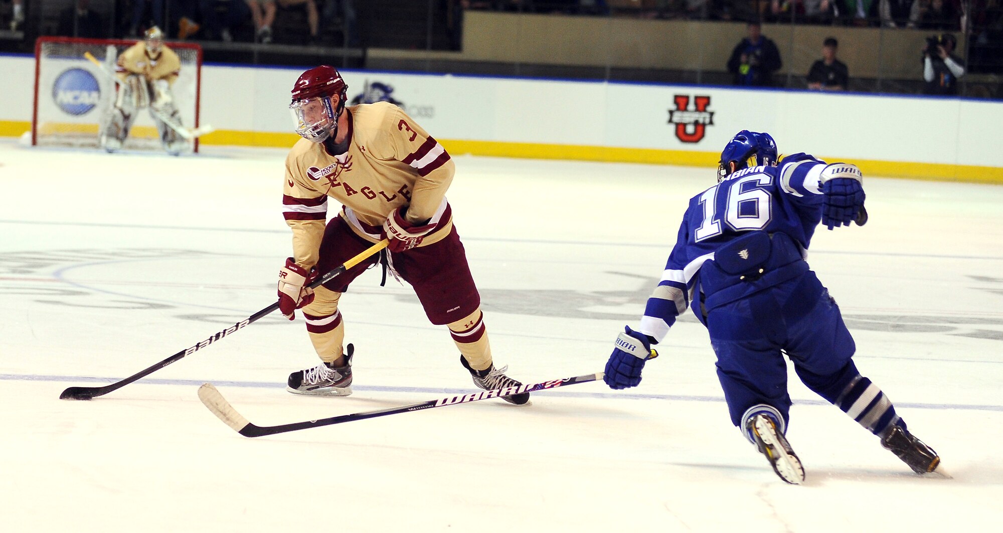 Jason Fabian (right) tries to get to Patch Alber during the NCAA Hockey Championship Tournament Saturday, March 24, 2012. The Falcons came up short against the Eagles 2-0. This was the Falcons' fifth trip to the tournament in the last six years. (U.S. Air Force photo/Tech. Sgt. Raymond Hoy)