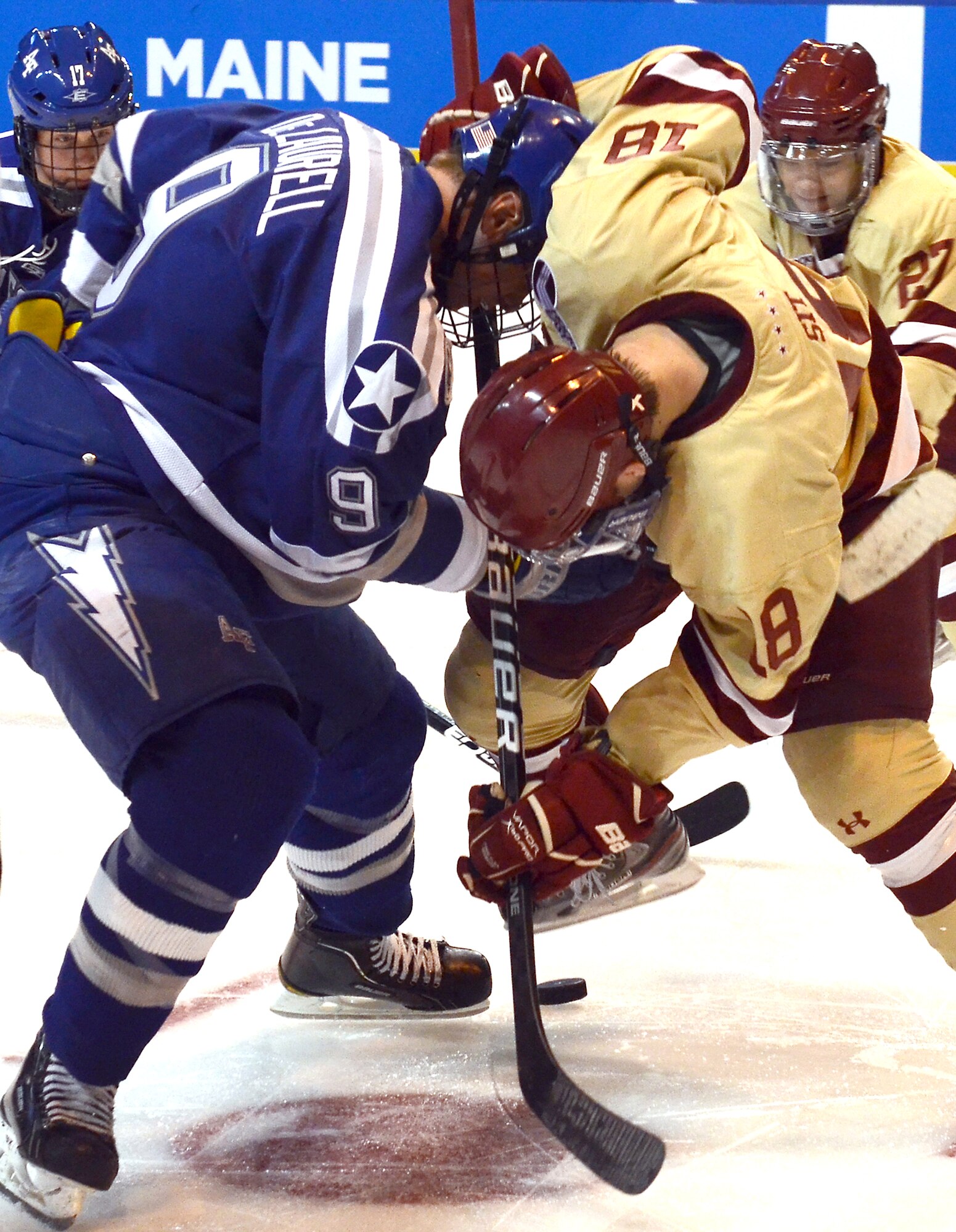 Kyle DeLaurell and Michael Sit face off during the NCAA Hockey Championship Tournament Saturday, March 24, 2012. The Falcons came up short against the Eagles 2-0. This was the Falcons' fifth trip to the tournament in the last six years. (U.S. Air Force photo/Tech. Sgt. Raymond Hoy)