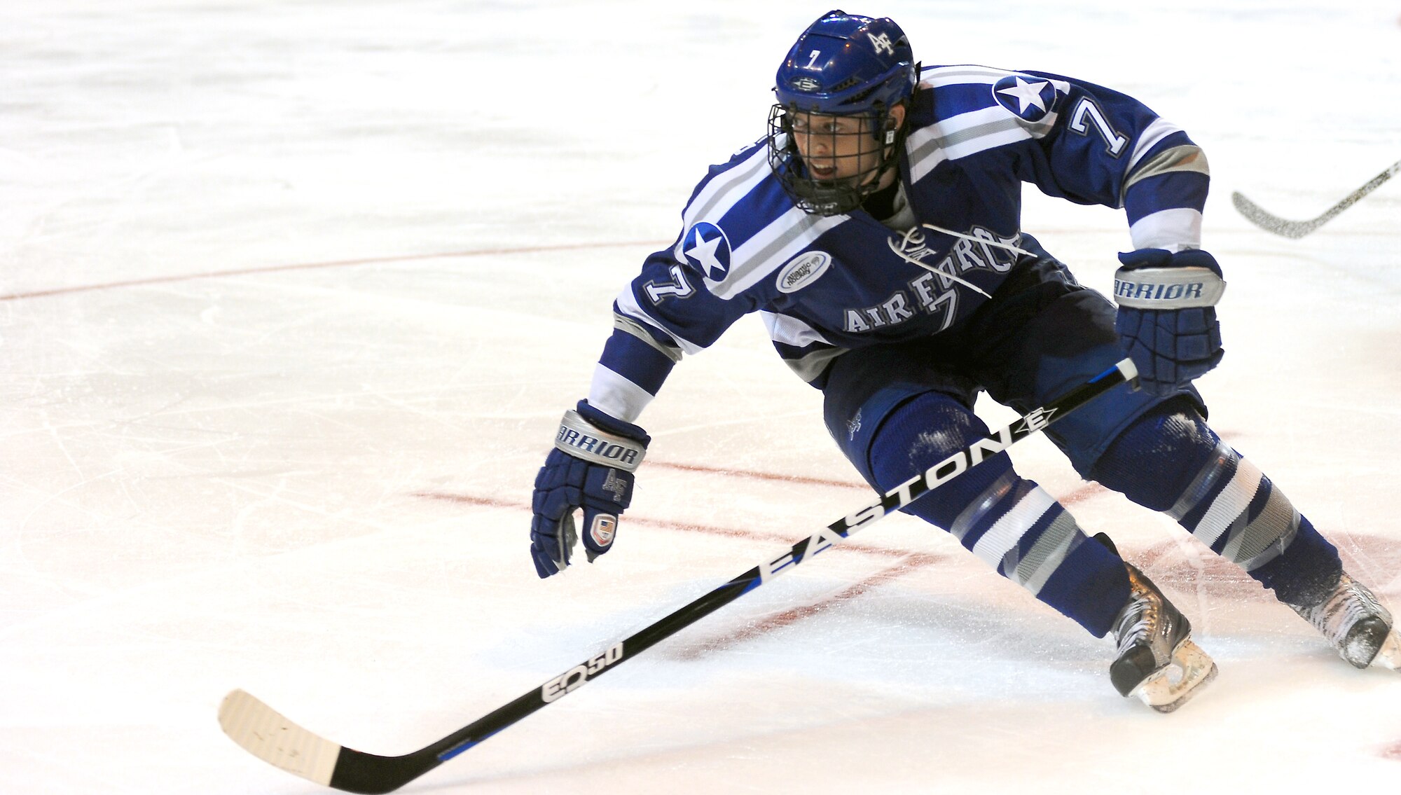 Casey Kleisinger tries to get to the puck during the NCAA Hockey Championship Tournament Saturday, March 24, 2012. The Falcons came up short against the Eagles 2-0. This was the Falcons' fifth trip to the tournament in the last six years. (U.S. Air Force photo/Tech. Sgt. Raymond Hoy)