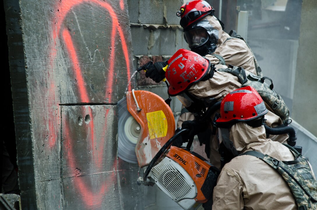 Missouri National Guard soldiers cut through cement during a Region 7 Homeland Response Force exercise at Muscatatuck Urban Training Center near Butlerville, Ind., March 23, 2012. More than 500 Missouri National Guard soldiers and airmen participated in the exercise, which evaluates their ability to react to large-scale disasters within the U.S. (Missouri Guard photo by Staff Sgt. Michael Crane)