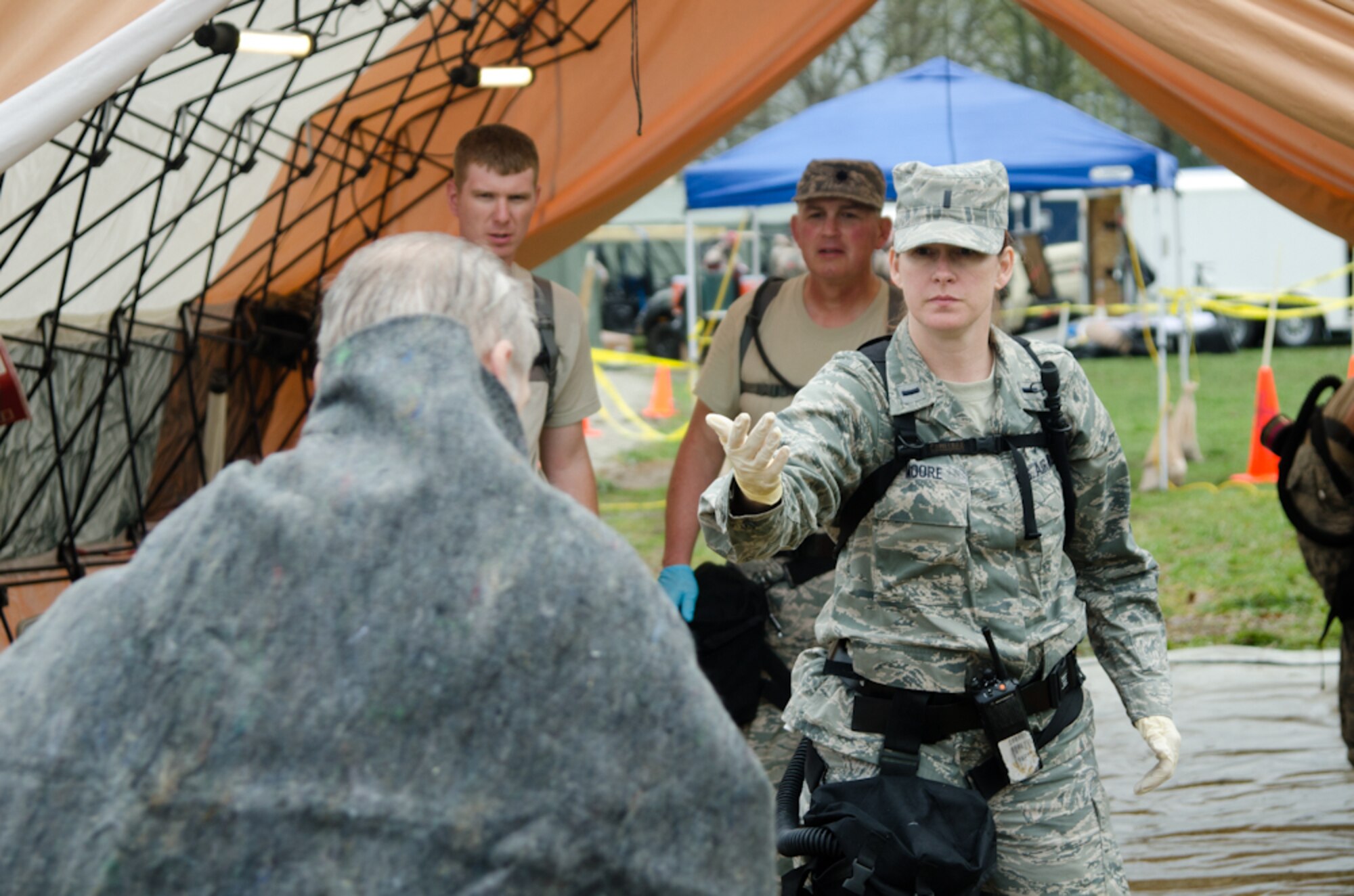 1st Lt. Alana Moore, a staff nurse with the 139th Medical Group, motions for a mock patient during a Region 7 Homeland Response Force exercise at Muscatatuck Urban Training Center near Butlerville, Ind., March 23, 2012. More than 500 Missouri National Guard soldiers and airmen participated in the exercise, which evaluates their ability to react to large-scale disasters within the U.S. (Missouri Guard photo by Staff Sgt. Michael Crane)