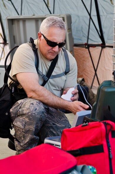 Lt. Col. (Dr.) John Barton, a flight surgeon with the 139th Medical Group, tests ultrasound equipment for trauma service during a Region 7 Homeland Response Force exercise at Muscatatuck Urban Training Center near Butlerville, Ind., March 20, 2012. More than 500 Missouri National Guard soldiers and airmen participated in the exercise, which evaluates their ability to react to large-scale disasters within the U.S. (Missouri Guard photo by Staff Sgt. Michael Crane)