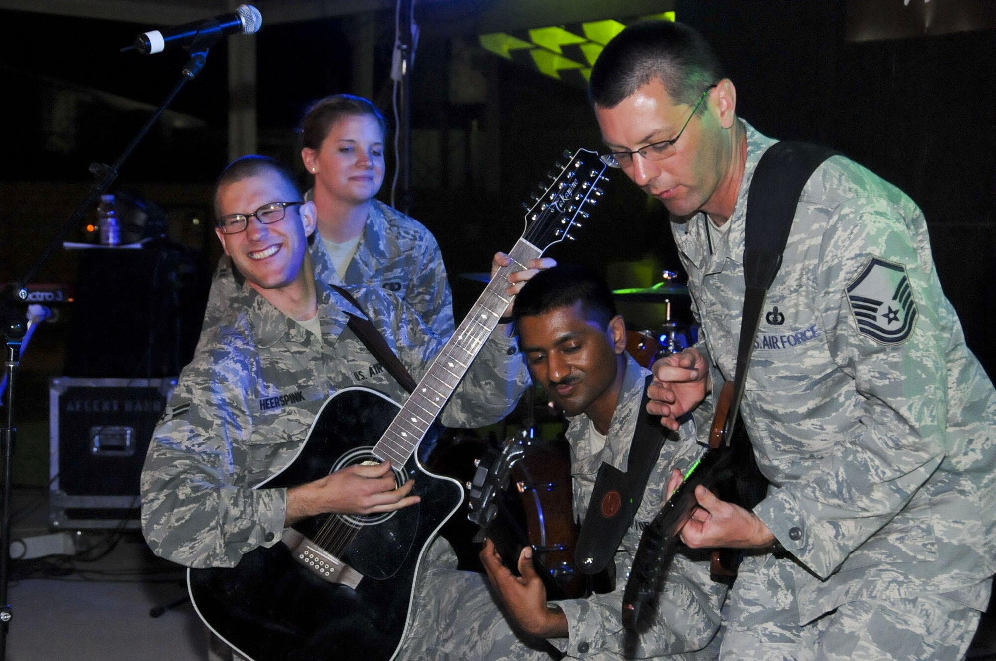 (From left to right) Airman 1st Class Lee Heerspink, male vocalist, Airman 1st Class Melissa Rager, female vocalist, Airman 1st Class Ryan Persaud, bass player, and Master Sgt. Richard Baisden, lead guitarist, perform as part of the U.S. Air Forces Central Band, Night Wing, in an undisclosed location, Southwest Asia, Mar. 24, 2012.  The band, deployed from Offutt Air Force Base, Neb., is a country and rock music ensemble visiting countries around the U.S. Central Command area of responsibility, bringing an eclectic mix of new and classic tunes to the delight of host nation civilians and military members. (U.S. Air Force photo/Staff Sgt. James Lieth)