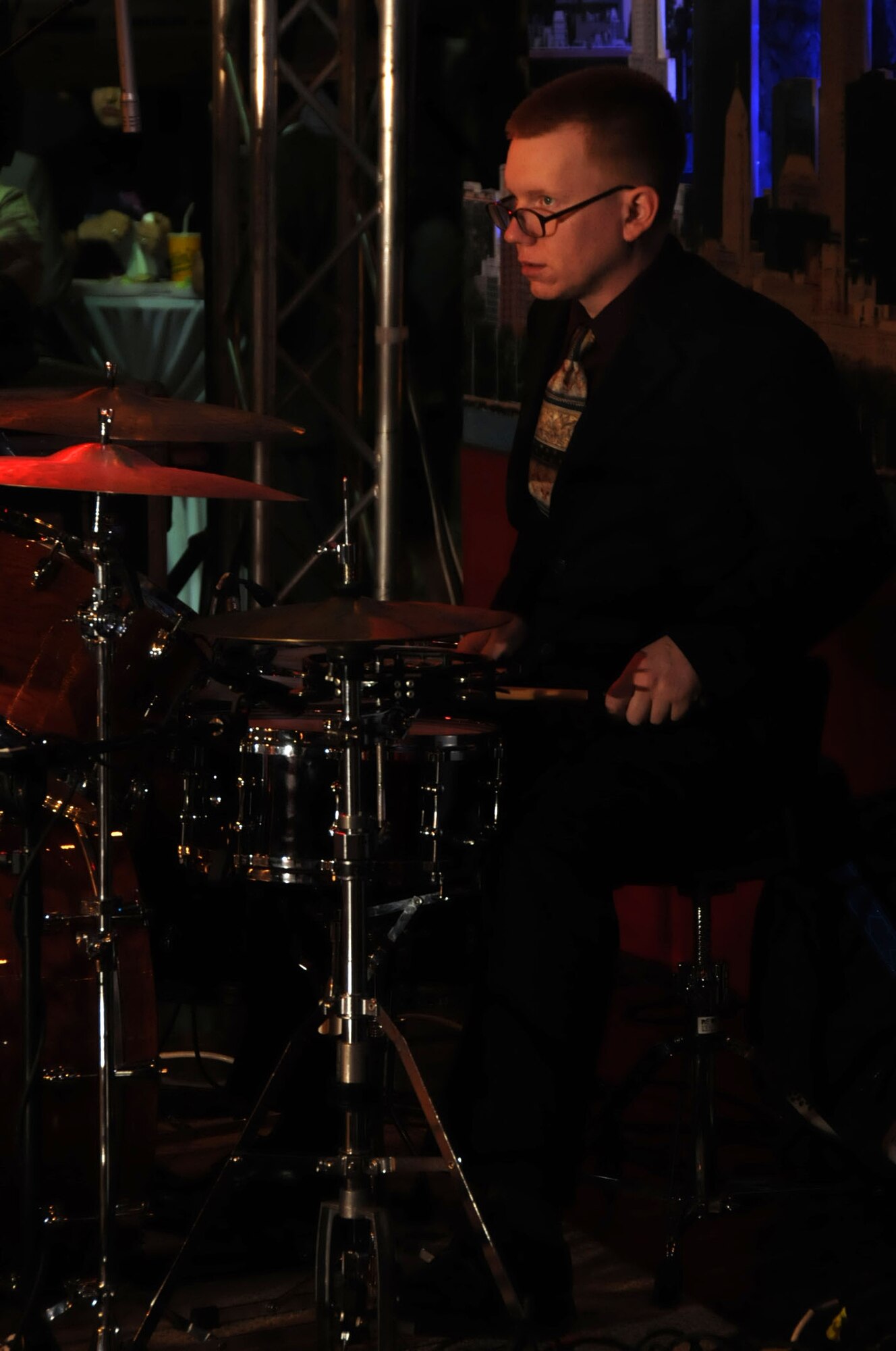 U.S. Air Force Staff Sgt. David Pojar, drummer in the U.S. Air Forces Central Band , Night Wing, performs in an undisclosed location, Southwest Asia, Mar. 21, 2012.  The band, deployed from Offutt Air Force Base, Neb., is a country and rock music ensemble visiting countries around the U.S. Central Command area of responsibility, bringing an eclectic mix of new and classic tunes to the delight of host nation civilians and military members. (U.S. Air Force photo/Staff Sgt. James Lieth)