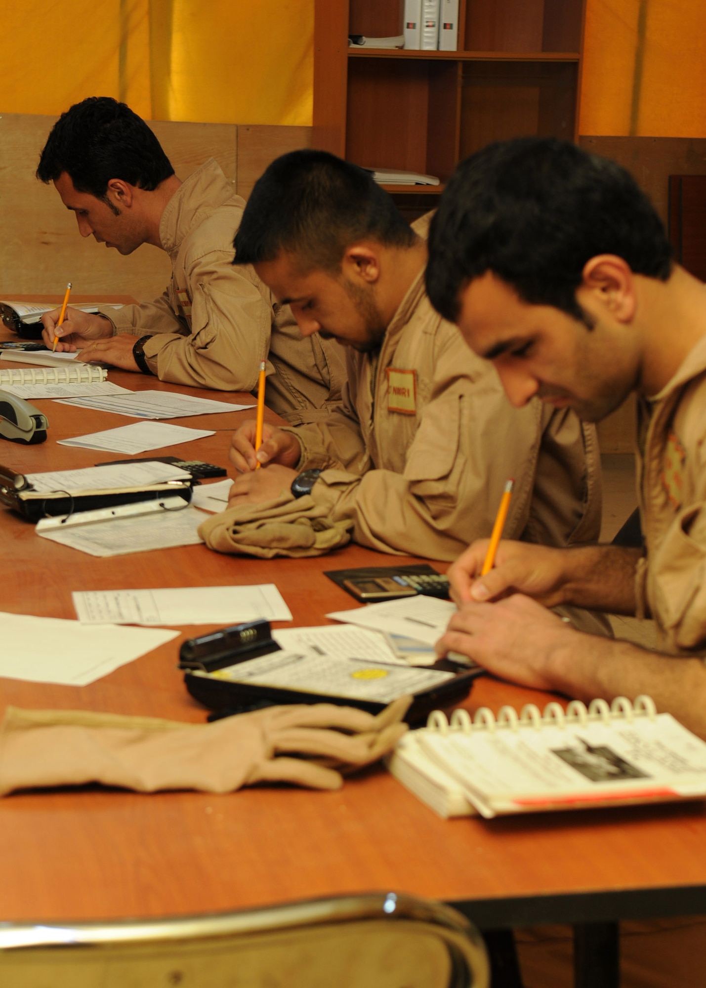 Afghan air force student pilots conduct preflight weight and balance checks for the AAF Cessna 182 aircraft prior to a flight at Shindand Air Base, Afghanistan, March 21, 2012. The student pilots were among seven to fly in Afghanistan’s first fixed-wing undergraduate pilot training flights in more than 30 years. (U.S. Air Force photo by Staff Sgt. Nadine Y. Barclay)

