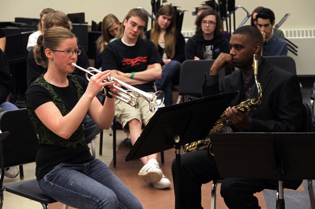 Eileen Dwyer performs scales for Gunnery Sgt. Jason Knuckles, 9th Marine Corps District Marine band placement director, during a practice audition in front of her high school music class March 26. Dwyer is a senior at Duluth East High School and hopes to one day play with the Marine Drum and Bugle Corps. For additional imagery from the audition, visit www.facebook.com/rstwincities.