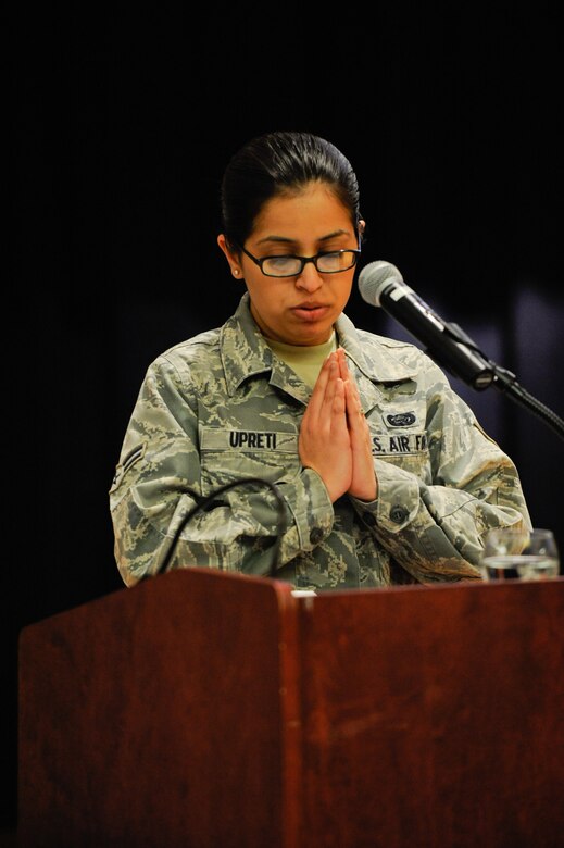 VANDENBERG AIR FOCE BASE, Calif. -- Airman 1st Class Shikha Upreti, a 30th Force Support Squadron separations and retirement specialist, leads a Hindu prayer during the National Prayer Luncheon at the Pacific Coast Club here Monday, March 26, 2012. More than 200 people attended the luncheon, which is observed as an extension of the National Prayer Breakfast held annually in Washington, D.C. (U.S. Air Force photo/Staff Sgt. Levi Riendeau)