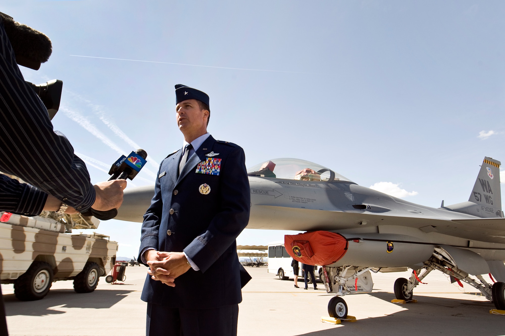 U.S. Air Force Brig. Gen. Charles L. Moore Jr., 57th Wing commander, speaks to the local news media moments after accepting command of the wing during a change of command ceremony March 26, 2012 at Nellis Air Force Base, Nev. Moore takes command of one of the most diverse wings in the Air Force, which  provides advanced aerospace training to world-wide combat air forces. (U.S. Air Force photo by Lawrence Crespo)
