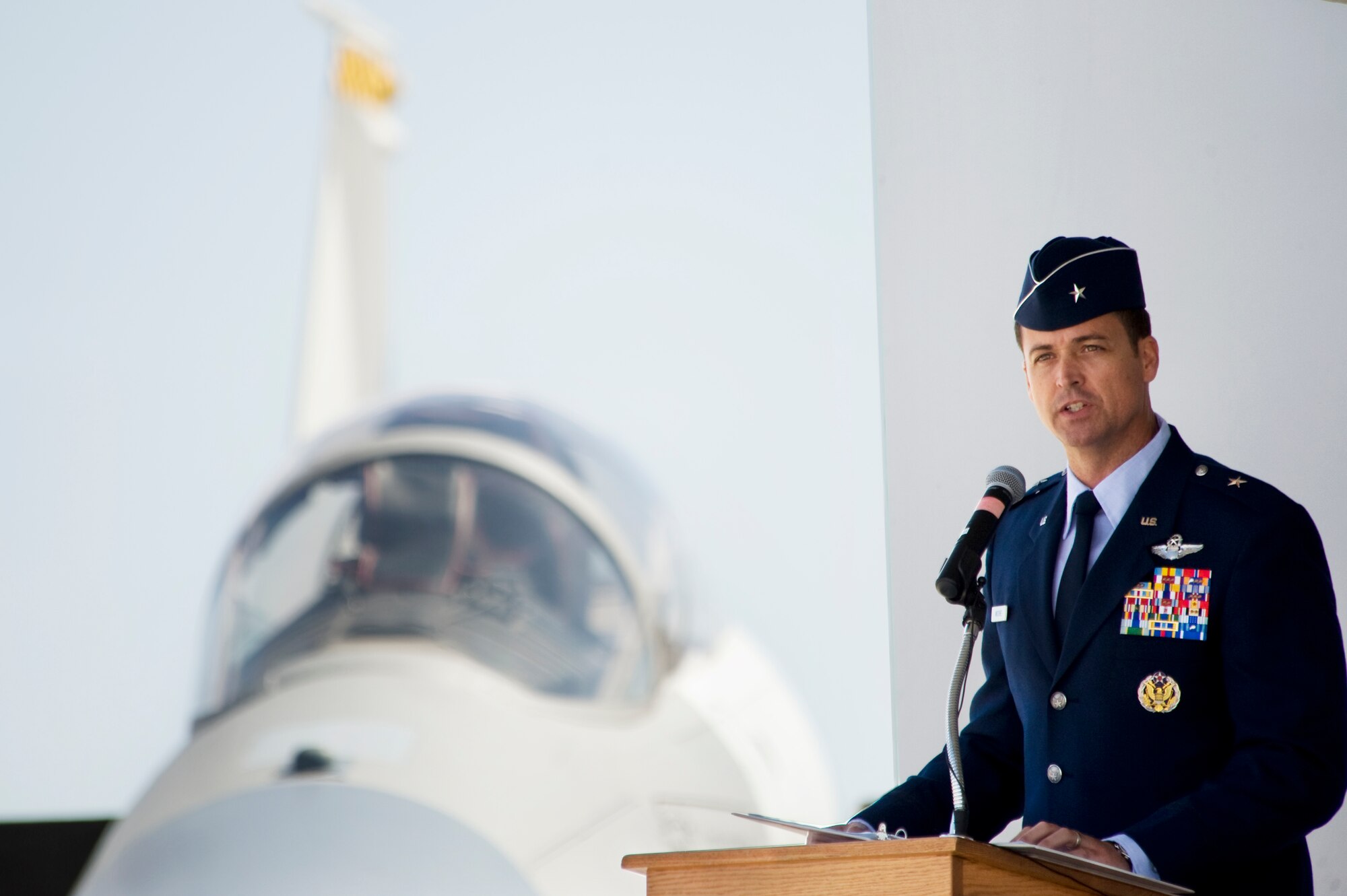 U.S. Air Force Brig. Gen. Charles L. Moore Jr., 57th Wing commander, speaks to the base populace moments after accepting command of the wing during a change of command ceremony March 26, 2012 at Nellis Air Force Base, Nev. Moore is responsible for 38 squadrons at 12 installations comprising the Air Force's most diverse flying wing. (U.S. Air Force photo by Lawrence Crespo)
