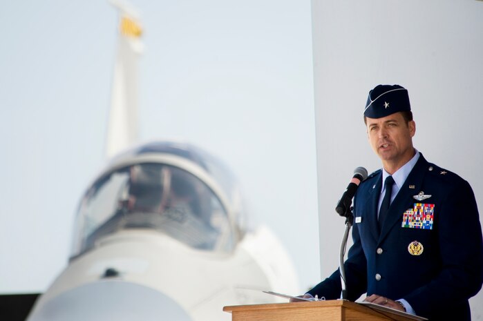 U.S. Air Force Brig. Gen. Charles L. Moore Jr., 57th Wing commander, speaks to the base populace moments after accepting command of the wing during a change of command ceremony March 26, 2012 at Nellis Air Force Base, Nev. Moore is responsible for 38 squadrons at 12 installations comprising the Air Force's most diverse flying wing. (U.S. Air Force photo by Lawrence Crespo)