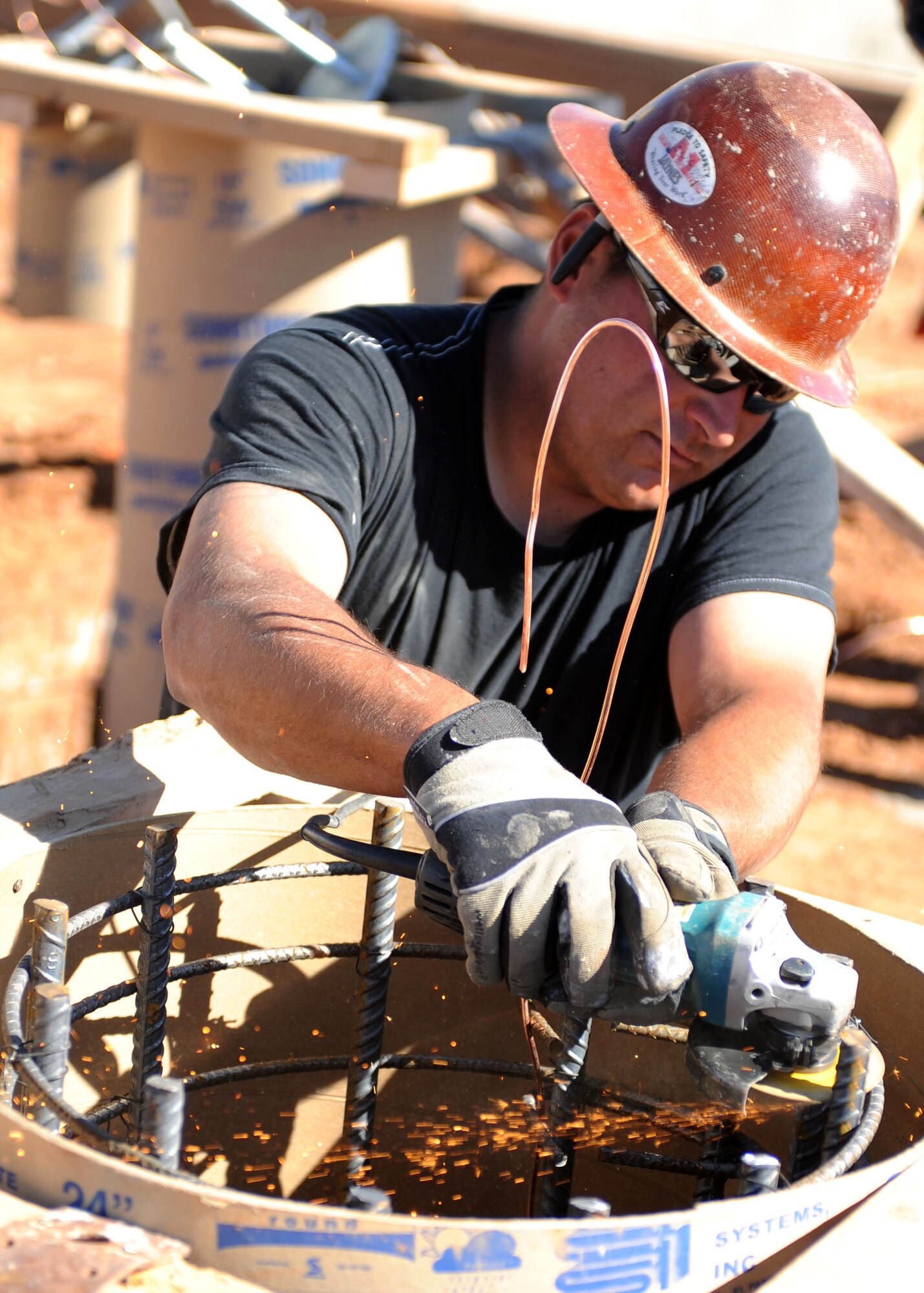 A construction worker labors to finish a structure for the new Liberty Pool at Cannon Air Force Base, N.M., March 16, 2012. Construction for the new pool began in October of 2011. (U.S. Air Force photo by Airman 1st Class Eboni Reece)