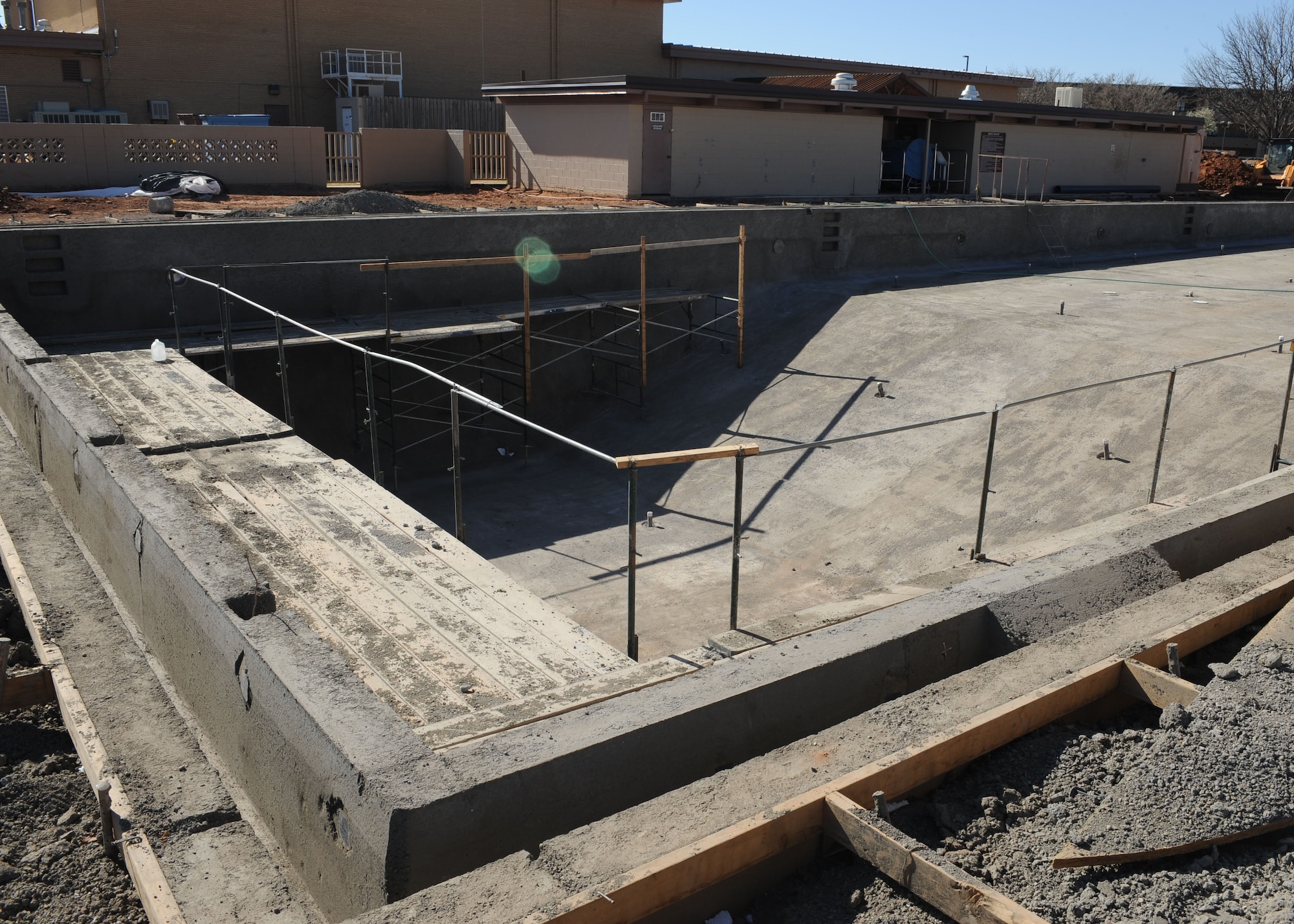 Construction persists on the Liberty Pool at Cannon Air Force Base, N.M., March 16, 2012. Major additions to the Liberty Pool include a waterslide, plunge pool, diving area, diving board, and a separate 1.5 foot deep baby wading pool.  (U.S. Air Force photo by Airman 1st Class Eboni Reece) 
