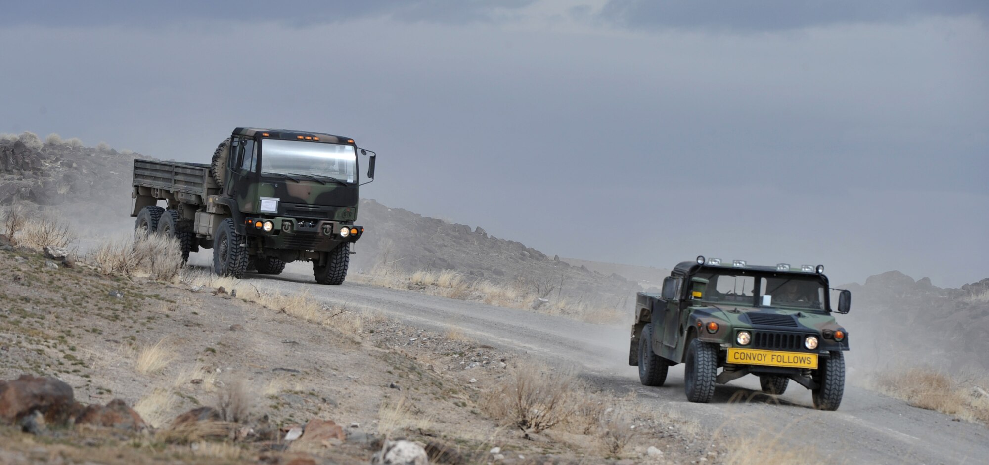 A convoy driven by members of the 726th Air Control Squadron, practices maneuvering through rough terrain while remaining alert for potential attack during exercise Mountain Roundup, March 13, 2012, at Saylor Creek Range, Idaho.  The 726th ACS is made up of 27 different Air Force career fields, making it self-sustaining and able to deploy and fully operate without external support or help. (U.S. Air Force photo/Airman 1st Class Heather Hayward)