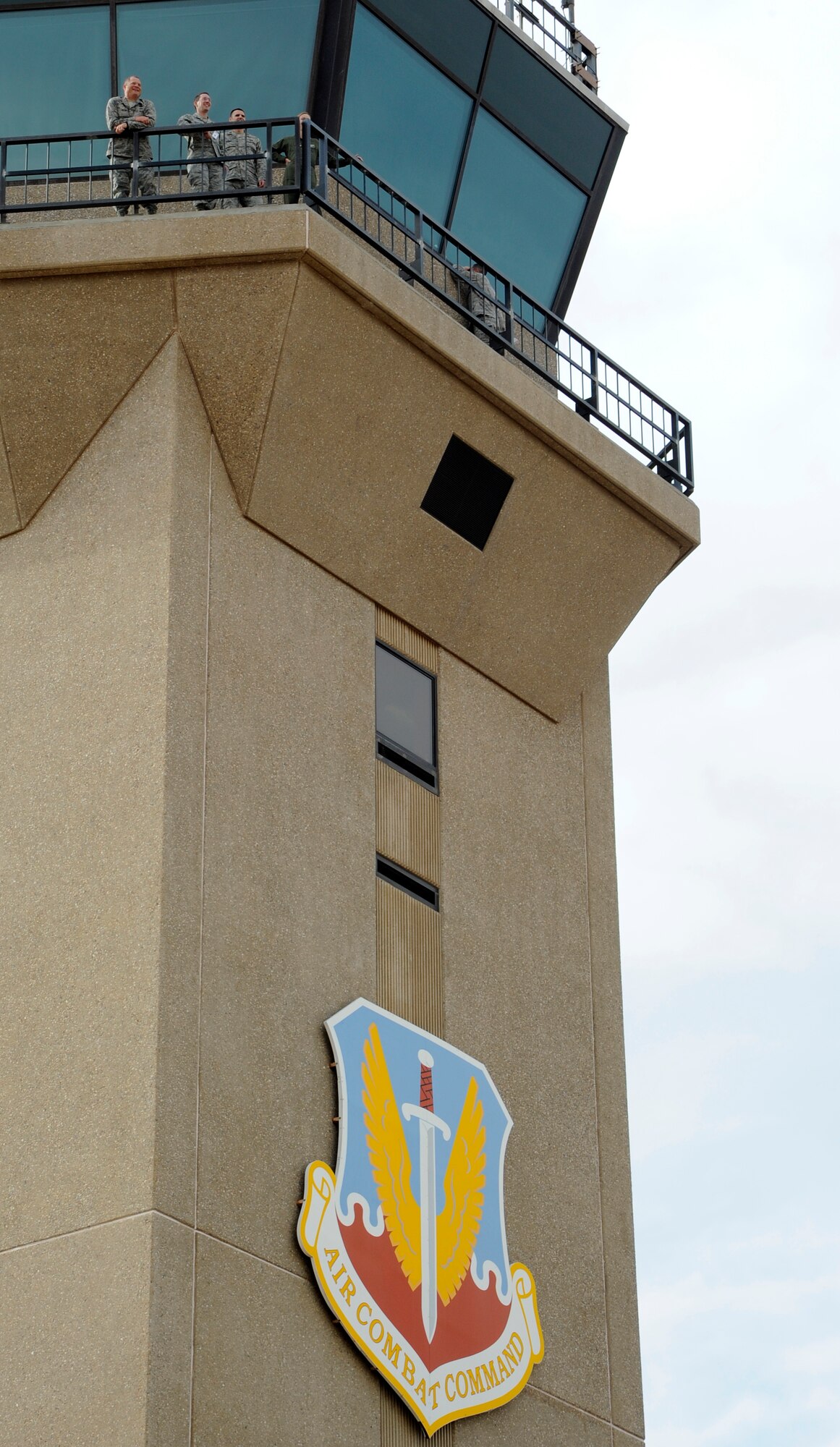 Members of Davis-Monthan Air Force Base and Commander in Chief Inspectors overlook the flightline from the catwalk of the control tower at Davis-Monthan AFB, Ariz., June 23, 2011. (U.S. Air Force photo by Tech Sgt Christopher Campbell/Released)