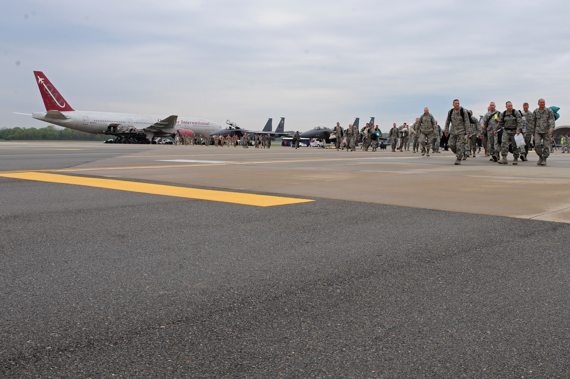 Airmen returning from a deployment to Bagram Airfield, Afghanistan, make their way to their loved ones on Seymour Johnson Air Force Base, N.C., March 26, 2012. The Airmen deployed for six months in support of Operation Enduring Freedom. While deployed, the Airmen successfully completed more than 2,500 sorties. (U.S. Air Force photo/Airman 1st Class John Nieves Camacho/Released)