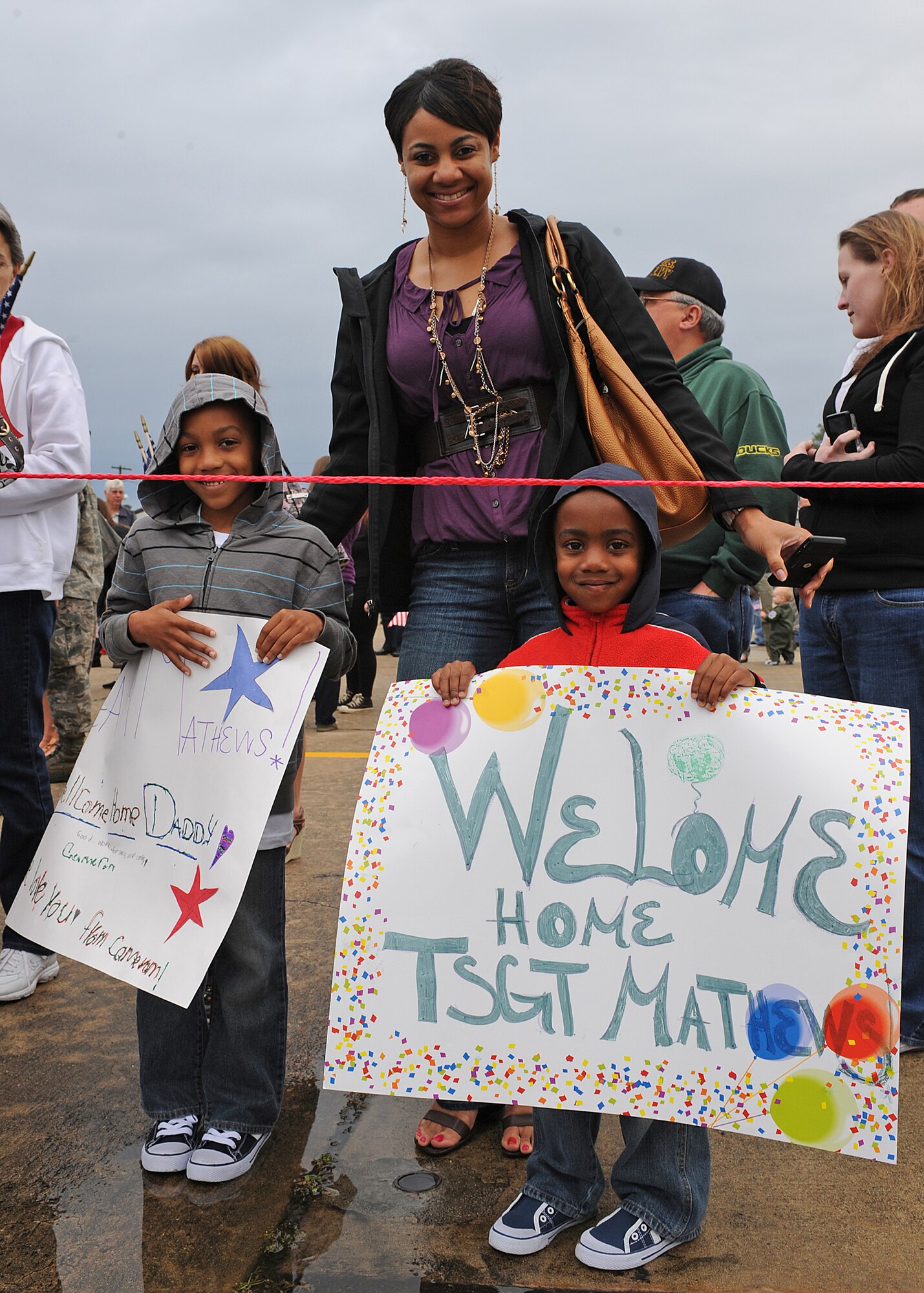 Shannon Mathews, and her sons, Cameron, left, and Austen patiently wait for her husband U.S. Air Force Tech. Sgt. Ronald Mathews to return to Seymour Johnson Air Force Base, N.C., March 26, 2012. Ronald deployed for six months to Bagram, Afghanistan in support of Operation Enduring Freedom. Shannon is a native of Carrollton, Ga. Ronald, 335th Aircraft Maintenance Unit expeditor, is from Atlanta. (U.S. Air Force photo/Airman 1st Class John Nieves Camacho/Released)