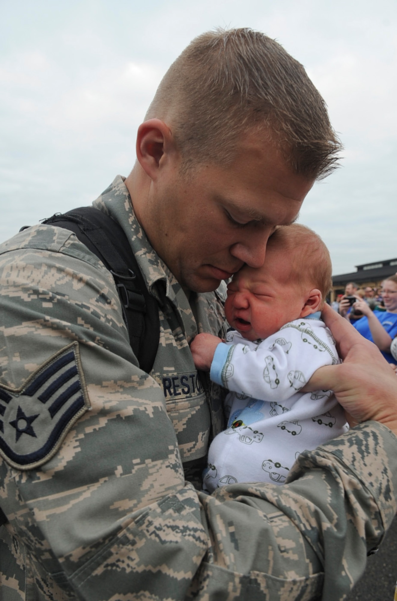 U.S. Air Force Staff Sgt. Richard Restorff holds his son, Brayden Restorff, for the first time on Seymour Johnson Air Force Base, N.C., March 26, 2012. Brayden was born three days prior to Restorff’s return from a six month deployment to Bagram Airfield, Afghanistan. Restorff is a member of the 4th Aircraft Maintenance Squadron. (U.S. Air Force photo/Airman 1st Class Aubrey Robinson/Released)