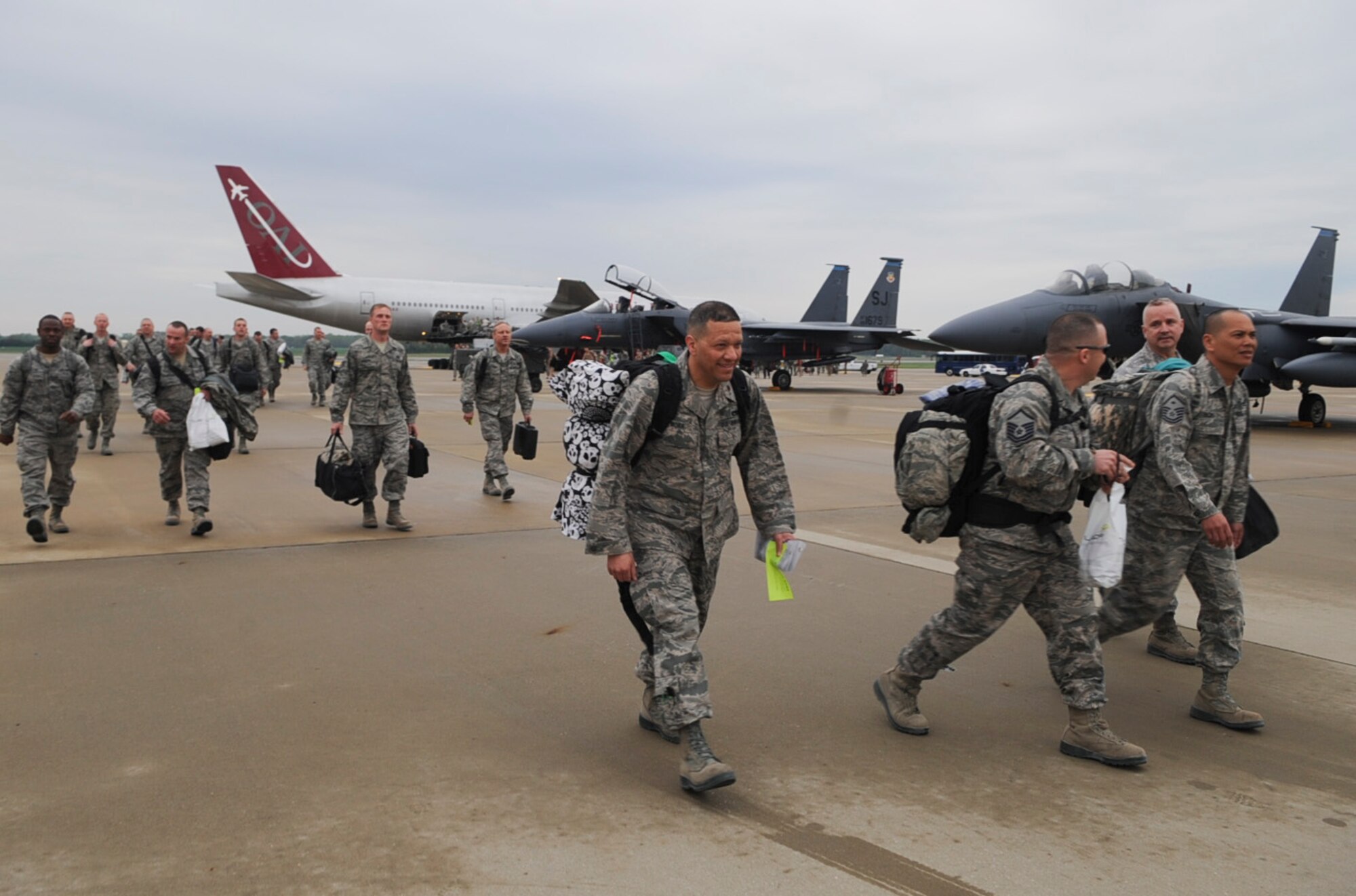 Airmen from the 4th Fighter Wing hurry to greet their families on Seymour Johnson Air Force Base, N.C., March 26, 2012. Maintainers deployed from the 335th Aircraft Maintenance Unit supported more than 2,500 sorties during a six-month deployment to Bagram Airfield, Afghanistan. (U.S Air Force photo/Airman 1st Class Aubrey Robinson/Released)