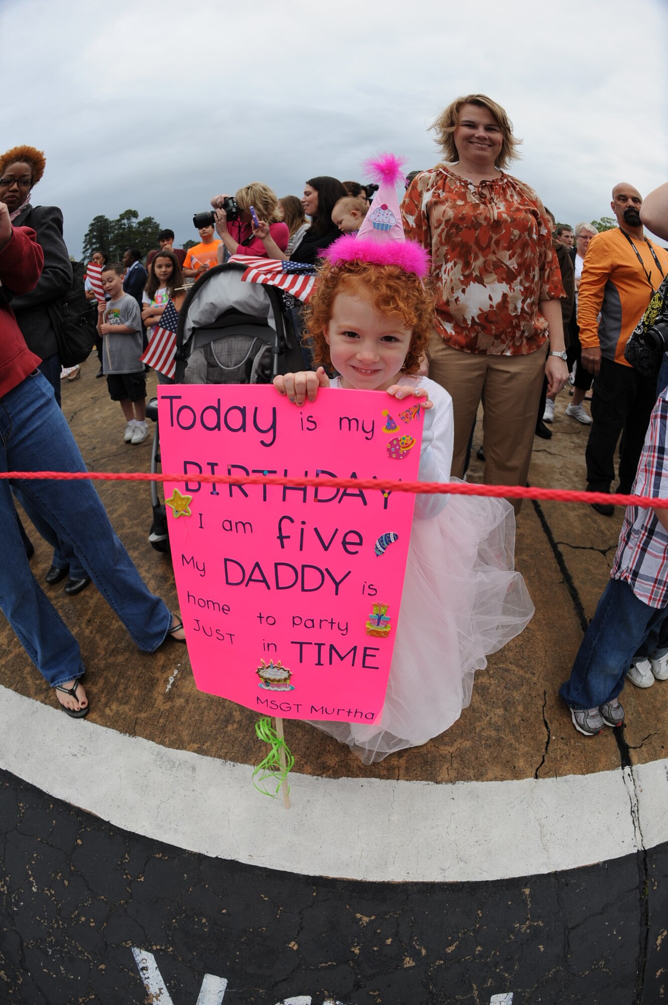 Kyla Murtha eagerly awaits the arrival of her father, U.S. Air Force Master Sgt. Patrick Murtha, on Seymour Johnson Air Force Base, N.C., March 26, 2012. Kyla celebrated her fifth birthday with the return of her father from a six month deployment to Bagram Airfield, Afghanistan. Murtha, 335th Aircraft Maintenance Unit, hails from Lansdowne, Pa. (U.S. Air Force photo/Airman 1st Class Aubrey Robinson/Released)

