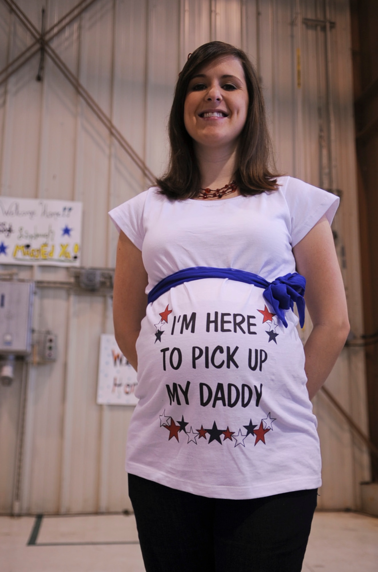 Meghan Burkhart patiently waits for her husband, U.S. Air Force Staff Sgt. Thomas Burkhart, to return from a six-month deployment to Bagram Airfield, Afghanistan, on Seymour Johnson Air Force Base, N.C., March 26, 2012. The Burkharts are expecting their first child. Burkhart, 4th Equipment Maintenance Squadron Munitions flight, hails from Maynardville, Tenn. (U.S. Air Force photo/Airman 1st Class Aubrey Robinson/Released)