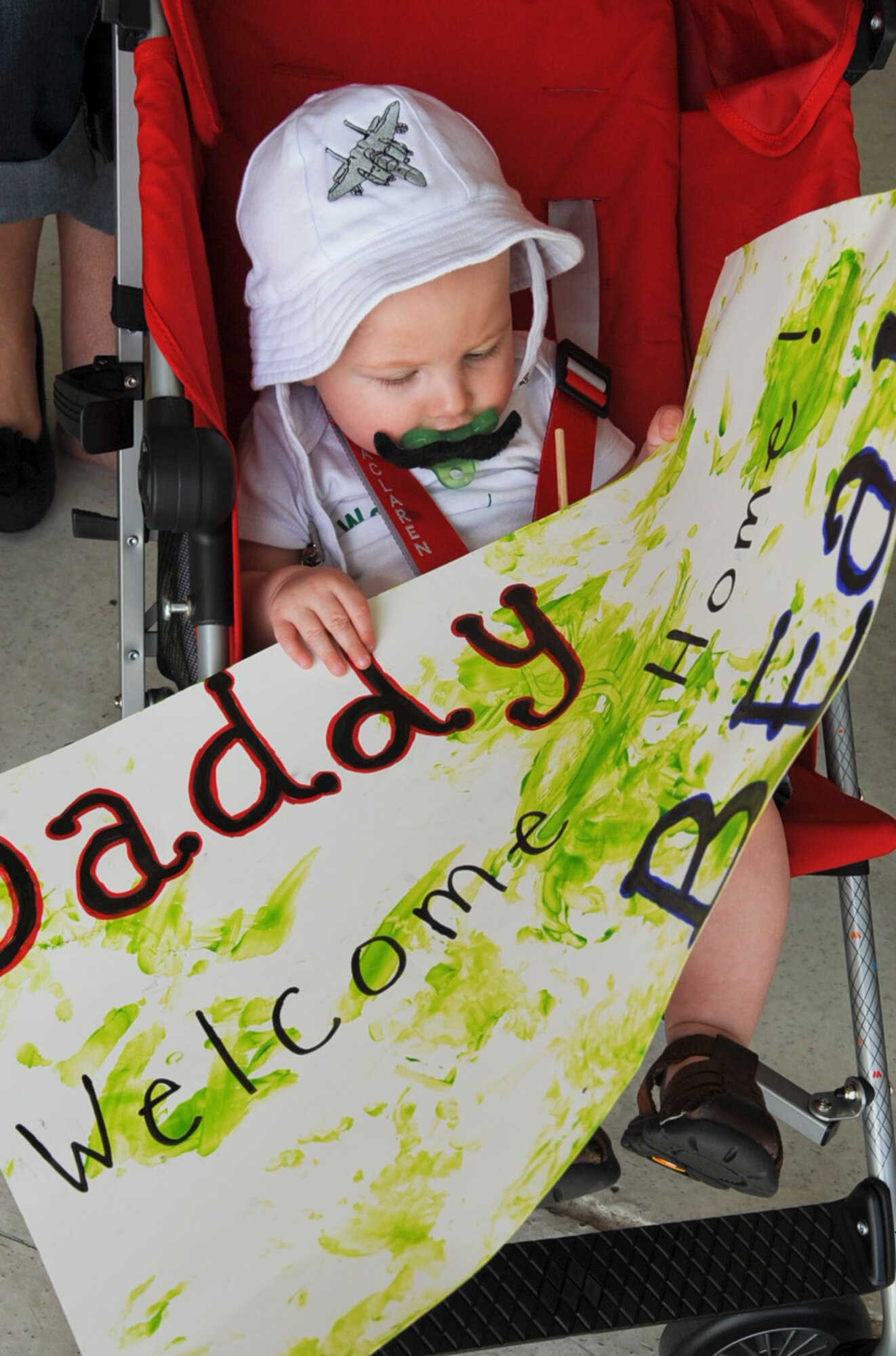 Jonny Haba awaits the arrival of his father, U.S. Air Force Capt. Jonathon Haba, from a deployment to Bagram Airfield, Afghanistan, on Seymour Johnson Air Force Base, N.C., March 23, 2012. Haba is returning from a six-month deployment supporting Operation Enduring Freedom. Haba, 335th Fighter Squadron weapon systems officer, hails from Concord, Mich. (U.S. Air Force photo/Airman 1st Class Aubrey Robinson/Released)