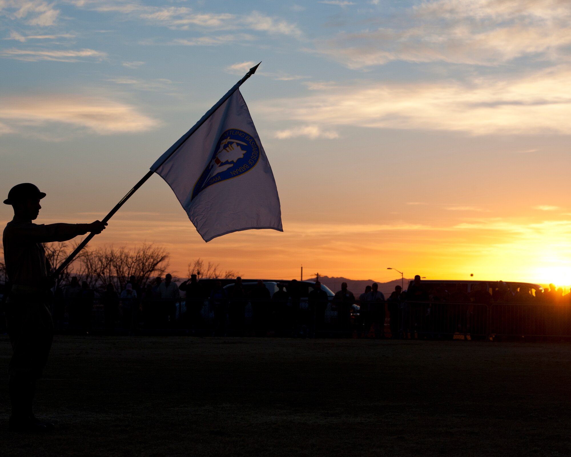 WHITE SANDS MISSILE RANGE, N.M. – A participant of the opening ceremony at the 23rd Annual Bataan Memorial Death March holds a flag March 25, during a moment of silence. The event, attended by a record number of more than 6,700 marchers, commemorates the original Bataan Death March which occurred in the Philippines during World War II. (U.S. Air Force photo by Senior Airman DeAndre Curtiss / Released)