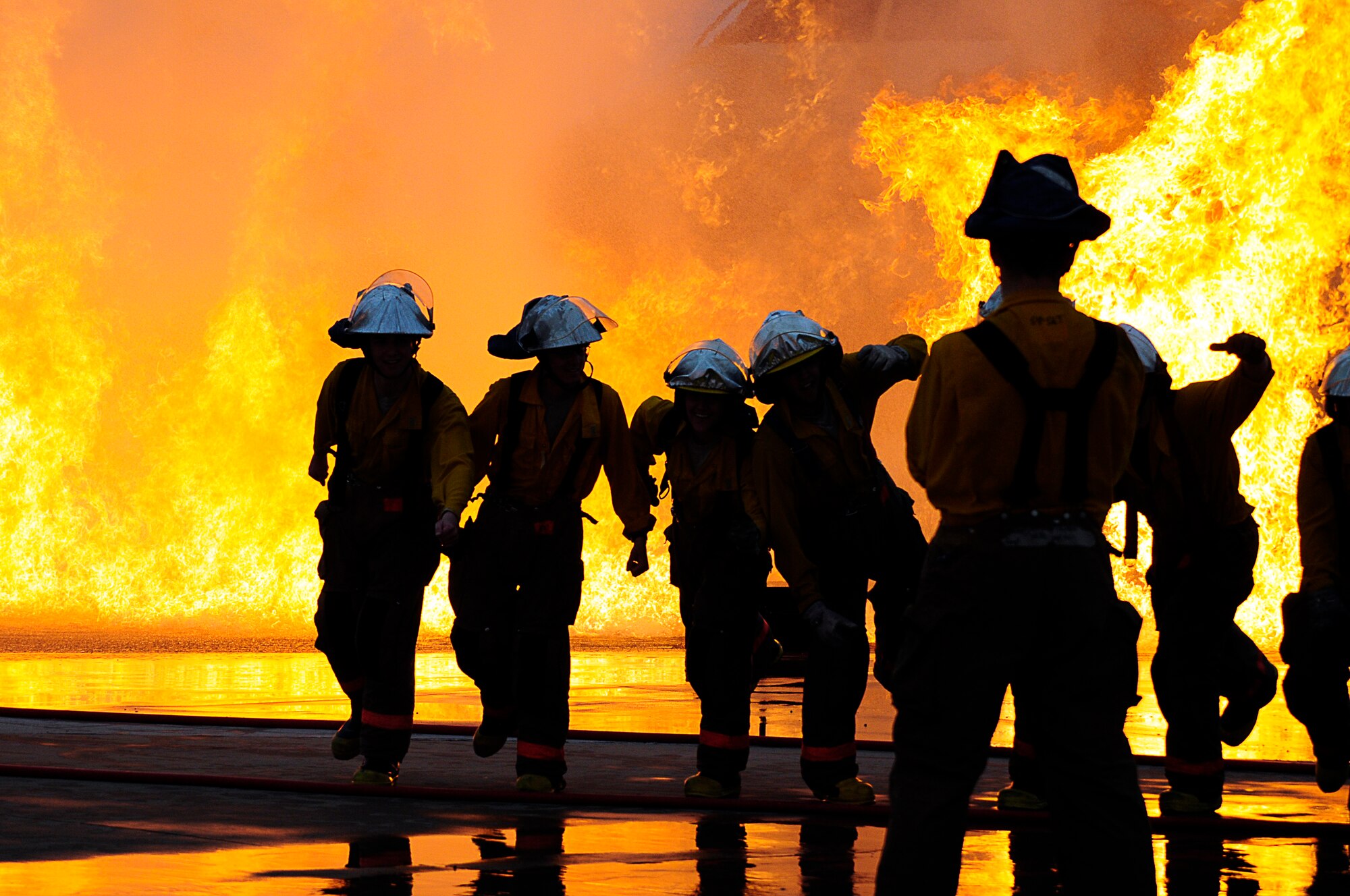 GOODFELLOW AIR FORCE BASE, Texas -- Servicemembers pose for a photo after nearly completing a firefighter course March 16. The Louis F. Garland DOD Academy is one of the most modern fire training facilities available in the world and provides internationally certified graduates to the Air Force, Army, Navy, Marine Corps and DOD civilian units. (US Air Force photo/Staff Sgt. Austin Knox)