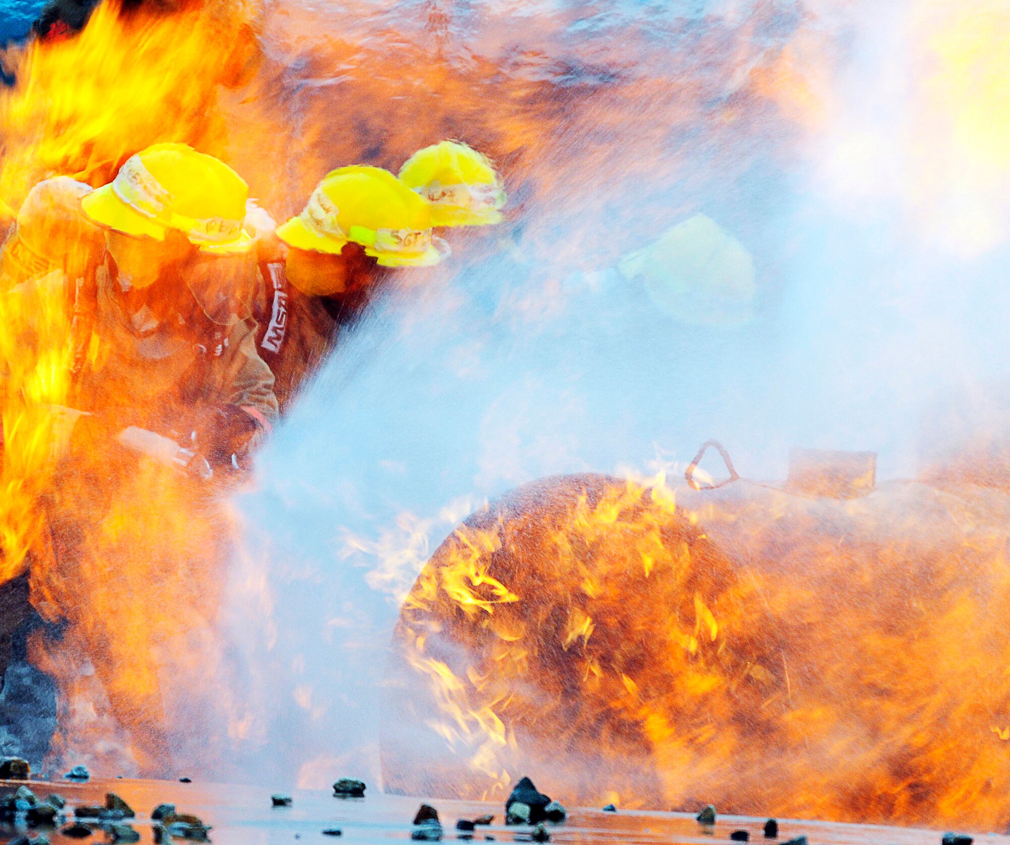GOODFELLOW AIR FORCE BASE, Texas -- Students from the 312th Training Squadron perform firefighter training at the Louis F. Garland DOD Fire Academy March 16.  The Academy opened in 1995, making Goodfellow the DOD's executive agent for fire protection training. (U.S. Air Force photo/Staff Sgt. Austin Knox)