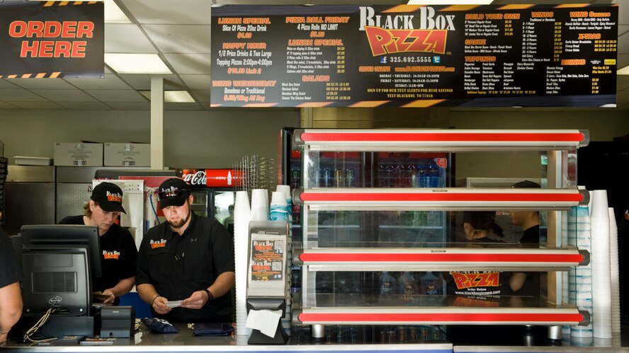 Black Box Pizza employees prepare for the grand opening March 26, 2012, at Dyess Air Force Base, Texas. Black Box Pizza is available by delivery to on-base residents as well as service members in Quail Hallow. For more information, call (325) 696-5555. (U.S. Air Force photo by Airman 1st Class Jonathan Stefanko/ Released)