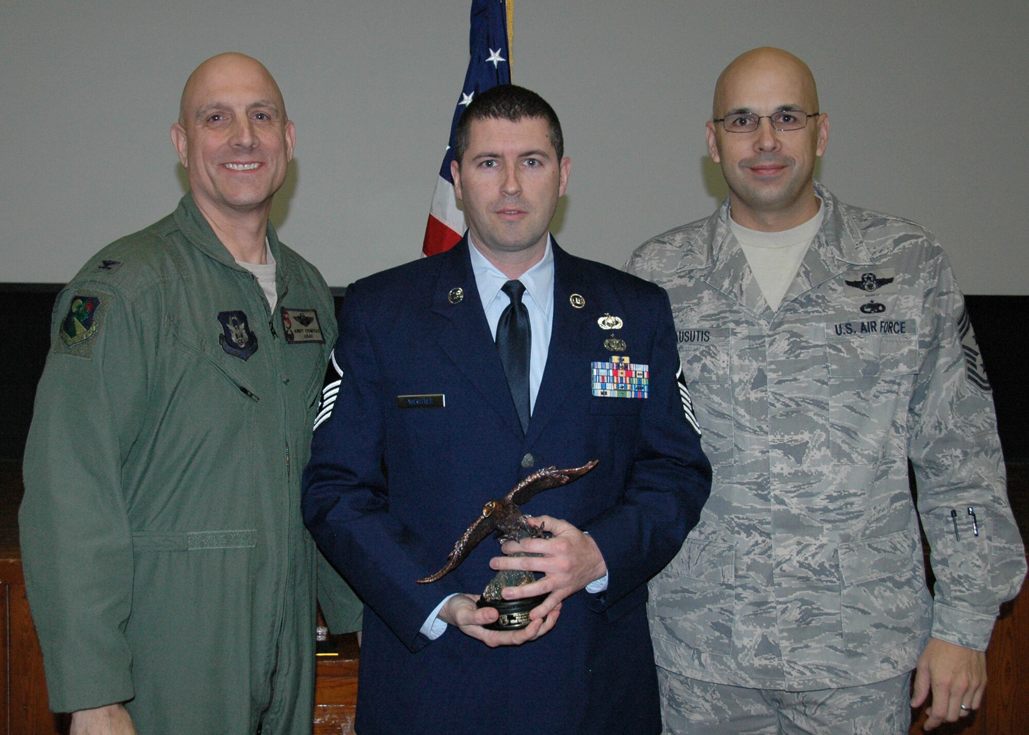 Master Sgt. Thomas Webster from the 919th Operations Group, Detachment 2, was named 919th Special Operations Wing Senior NCO of the Year for 2011 during the wing's March unit training assembly at Duke Field.  Flanking him are Col. Andy Comtois, 919th SOW commander, left, and Chief Master Sgt. Michael Klausutis, 919th SOW command chief, who likewise honored their most outstanding Citizen Commandos in the Airman, NCO and company grade officer categories.  (U.S. Air Force photo/Dan Neely)