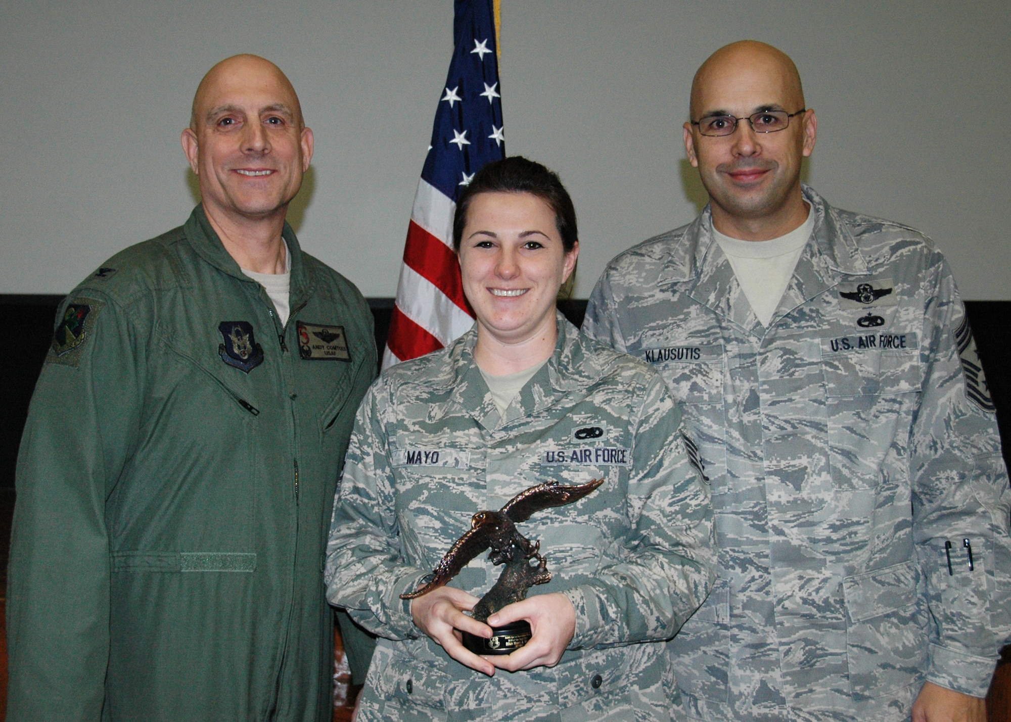 Staff Sgt. Mary Mayo of the 919th Maintenance Operations Flight was named 919th Special Operations Wing NCO of the Year for 2011 during the wing's March unit training assembly at Duke Field.  Flanking her are Col. Andy Comtois, 919th SOW commander, left, and Chief Master Sgt. Michael Klausutis, 919th SOW command chief, who likewise honored their most outstanding Citizen Commandos in the Airman, Senior NCO and company grade officer categories.  (U.S. Air Force photo/Dan Neely)