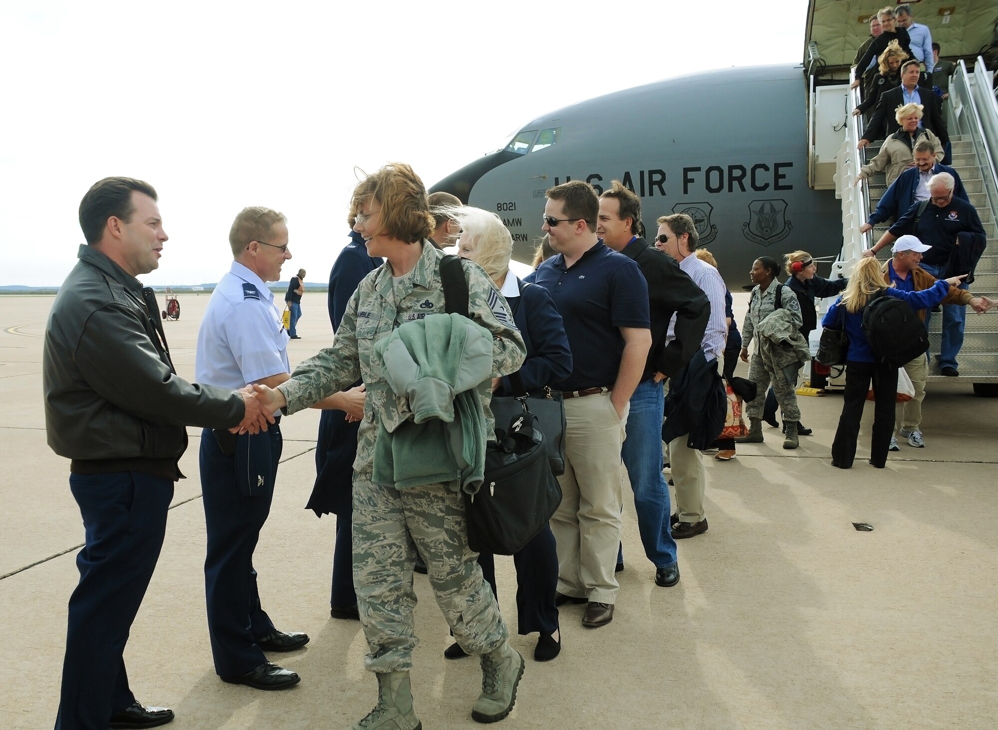 Dyess Air Force Base, Texas -- A welcoming crew at Dyess Air Force Base, Texas, greets more than 20 military and civic leaders visiting from Macdill Air Force base in Tampa, Florida, March 19, 2012.  The visit was part of an honorary commander's tour sponsored by the 927th Air Refueling Wing and included a chance for honorary commanders to learn about Dyess AFB's B-1 Lancer and C-130 Hercules aircraft.  (U.S. Air Force photo by Staff Sgt. Jennie Chamberlin)