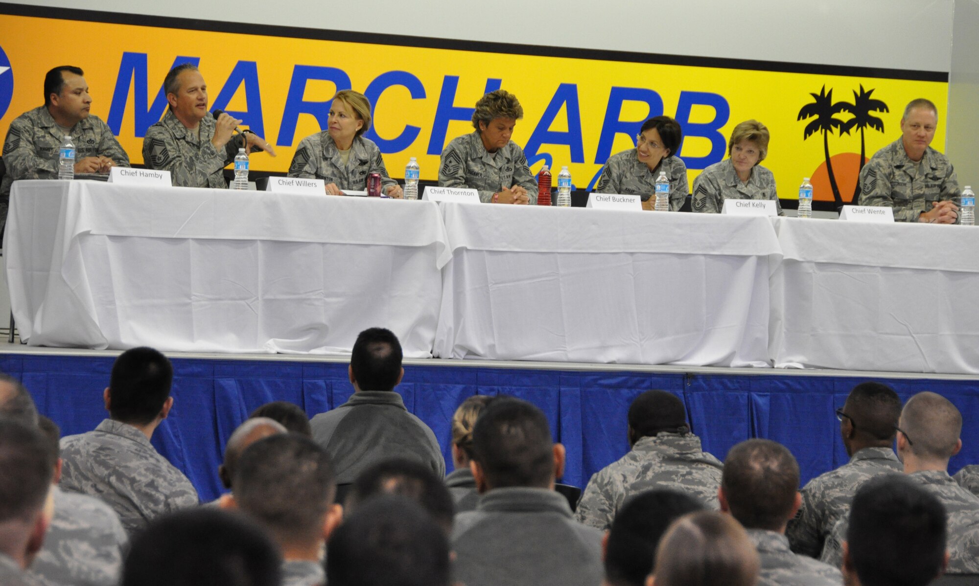 Chief Master Sgt. Daniel Willers, 452 Maintenance Group, (2nd from left) addresses a question posed by one of the 400 enlisted Airmen attending a Chiefs' panel at the end of the 452 Air Mobility Wing's two day Enlisted Workshop, held in Bldg. 2306, Sunday, March 18. The panel included from left to right, Chief Master Sgt. Henry Hamby, 452 Civil Engineering Squadron; Chief Master Sgt. Patricia Thornton, Air Force Reserve Command, Chief, Enlisted Force Development Support; Chief Master Sgt. Kathleen Buckner, Air Force Reserve Command, Command Chief; Chief Master Sgt. Ericka Kelly, 452 Air Mobility Wing, Command Chief; Chief Master Sgt. Cheryl Wente, 452 Medical Group, and Chief Master Sgt. Dennis Nodine, 452 Operations Group. In addition to answering questions, the elite panel of Chiefs also offered guidance and encouragement to the enlisted members of the 452 Air Mobility Wing. (Staff Sgt. Megan Crusher)