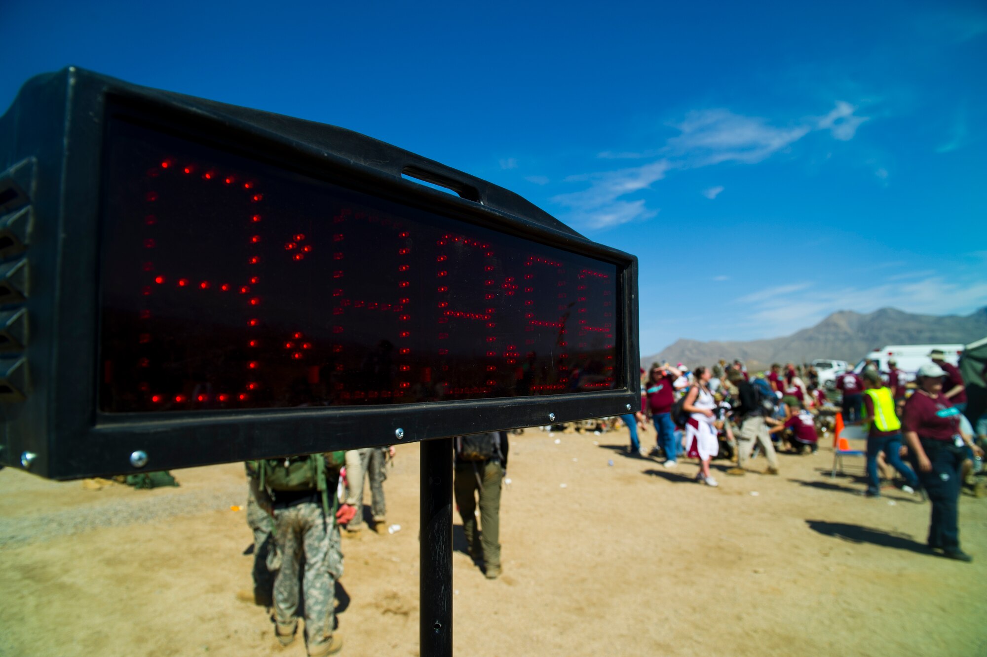 WHITE SANDS MISSILE RANGE, N.M. – A time indicator stands near the halfway point along the course of the Bataan Memorial Death March here March 25. Ken Gordon, 47, of Albuquerque, N.M., finished first with a chip time of 3:18:57. The first female to finish was Pam Nielsen, 35, of Minnetonka, Minn., with a chip time of 3:32:12. Both competed in the civilian - light category. (U.S. Air Force photo by Airman 1st Class Daniel E. Liddicoet/Released)