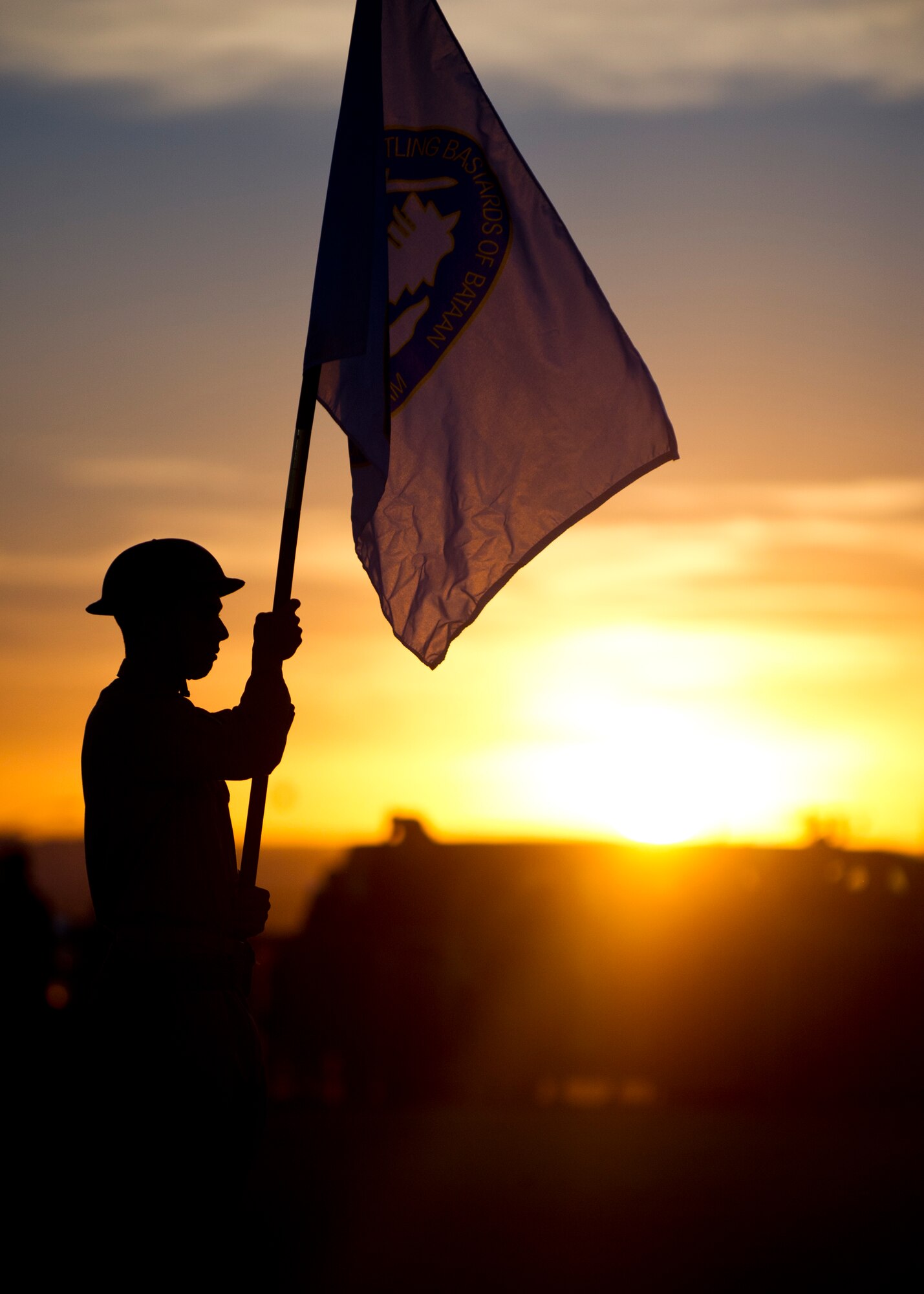WHITE SANDS MISSILE RANGE, N.M. – A U.S. Army member posts the flag of the Battling Bastards of Bataan at the opening ceremony of the Bataan Memorial Death March here March 25. This was the 23rd annual Bataan Memorial Death March. (U.S. Air Force photo by Airman 1st Class Daniel E. Liddicoet/Released)