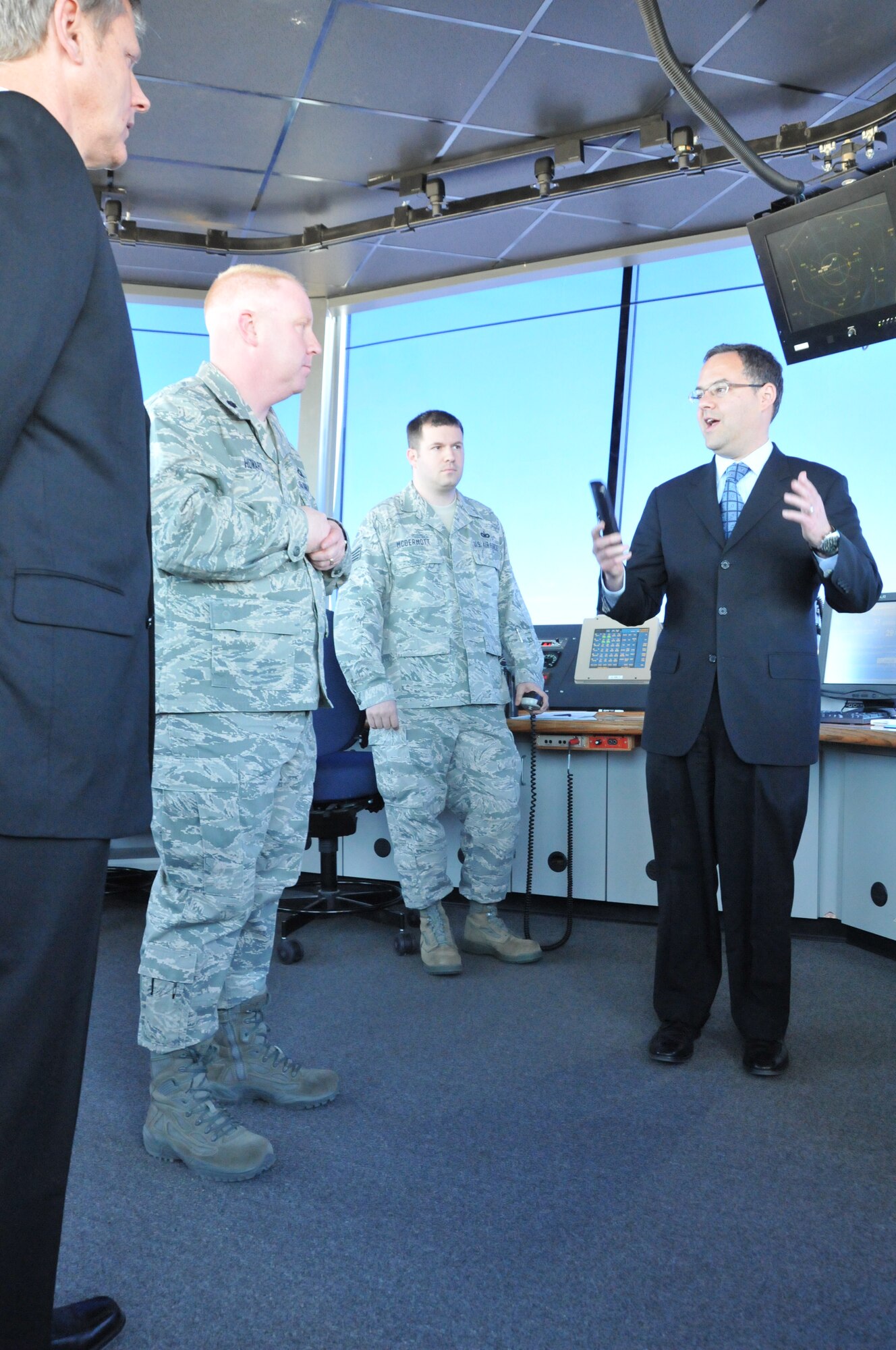 The Honorable Daniel B. Ginsberg, Assistant Secretary of the Air Force for Manpower and Reserve Affairs, speaks with Barry Dishman, air traffic manager, Lt. Col. Christopher Howard, 243rd Air Traffic Control Squadron commander and Staff Sgt. Sean McDermott, 243 ATCS controller, in the Cheyenne Regional Airport air traffic control tower March 20, 2012. The secretary visited Airmen of the Wyoming Air National Guard, toured facilities and answered questions relating to budgets and the future of the Air National Guard. (U.S. Air Force photo by 1st Lt. Rusty Ridley)